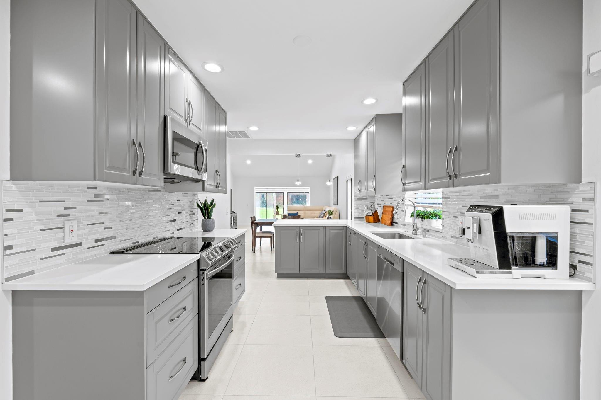 Stunning 2 Bedroom 2 Bathroom villa with 1856 SQ FT Under AC located in the The Greens at Boca Lago gated 55+ community. New Roof Installed IN 2024, New Refrigerator & Stove 2024, New Water Heater November 2025, Current Monthly Homeowners Insurance Seller Is Paying $1200.00 Per Year For Contents Coverage. Tastefully remodeled villa with high end appliances and modern finishes with an electric car charger. Community is 24 hour manned gated with convenient access to nearby shopping, dining, parks, medical and highways.  Building Is Insured through condo association fees of $880.00 per month. Easy to show.