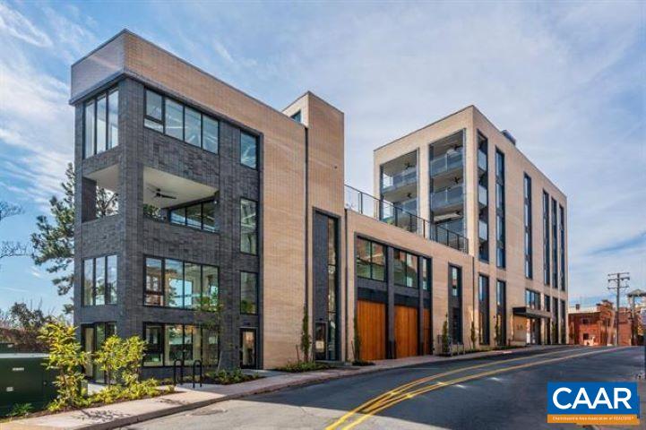 Located just one block from Charlottesville’s Historic Downtown Mall, The 550 represents the pinnacle of boutique, luxury living. Designed by Formwork and constructed by Martin Horn, this award-winning glass and brick landmark was recognized by the Urban Land Institute as the Most Influential Residential Construction Project of 2018. It is the only residence in the building with its own private entrance off Water Street. This striking three bedroom, three bath home features architect-designed details through out, including a stunning custom staircase, expansive windows and an open-concept living space that seamlessly blends style and function. Enjoy both a private covered terrace and an expansive rooftop deck with panoramic downtown and mountain views. The full-floor primary suite offers exceptional privacy and comfort, while two additional bedrooms provide flexibility for guests or a home office. Additional highlights include secure garage parking for two vehicles and the ease of low-maintenance, lock-and-leave living all in one of Charlottesville’s most desirable downtown locations.