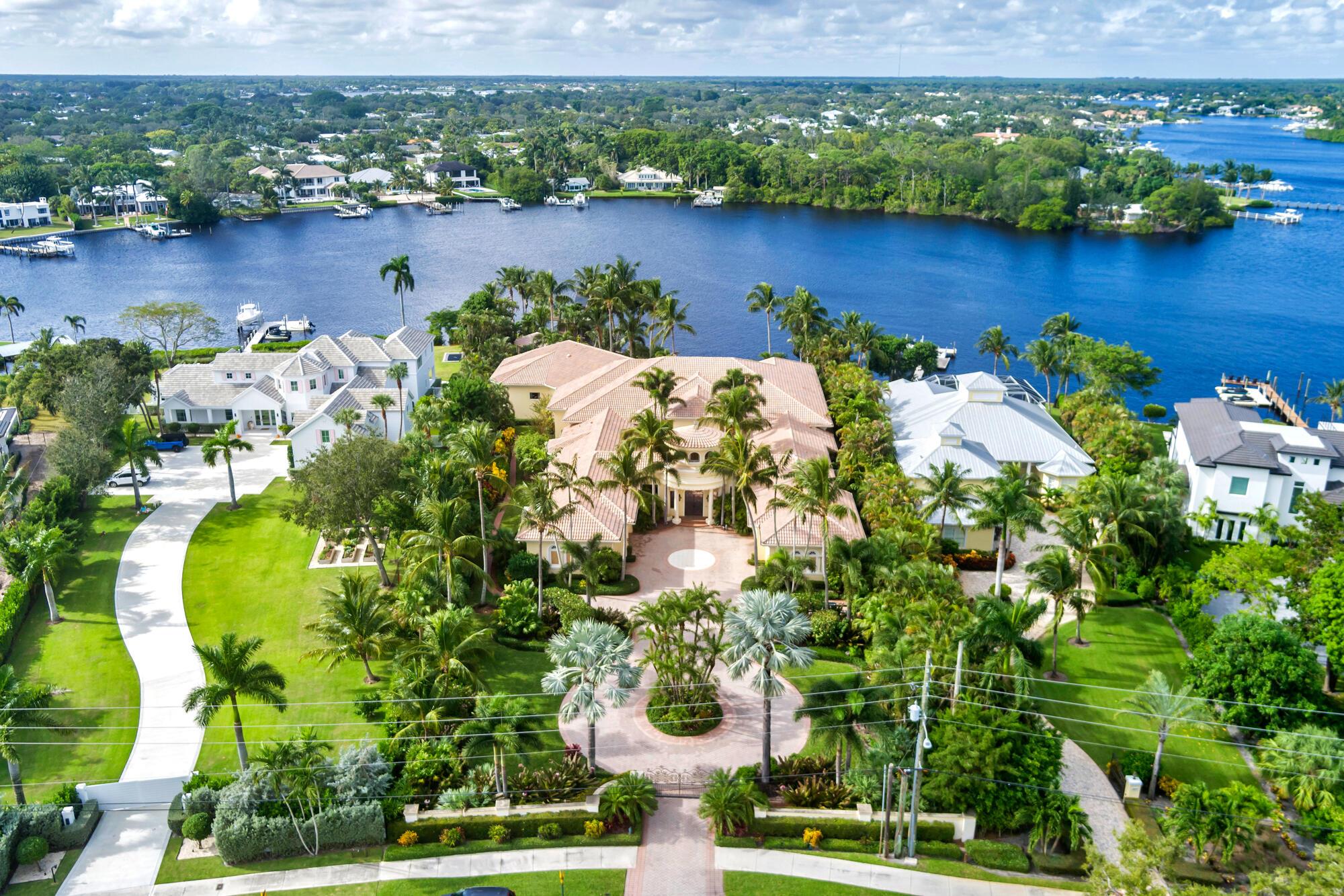 Hidden on the Loxahatchee River rests the most expansive, private waterfront estate in all of Tequesta. Boasting 130' of water frontage with pristine private westerly views of a protected river frontage in the distance. This glorious 17,000' single-story home is situated on a massive 52,000' lot. Featuring 5 spacious bedrooms, 5+ bathrooms, a 5 car garage (with a 6th A/C'd storage bay,) a sprawling resort-style covered patio with grotto-like swimming pool, a detached concrete block gazebo, a separate boathouse & a covered boat lift. The magic of this property is everywhere but it begins at the grand courtyard entry. With colossal iron/glass entry doors, the home was designed with entertaining and privacy in mind. The Loxahatchee River and pool are the perfect backdrop to every common area as well as the primary bedroom and office suites.
Close to amazing dining both by water or by car. This home is minutes to the Jupiter inlet, premier waterfront dining, shopping &amp; in close proximity to top private &amp; public schools, golf courses, country clubs and much more.
