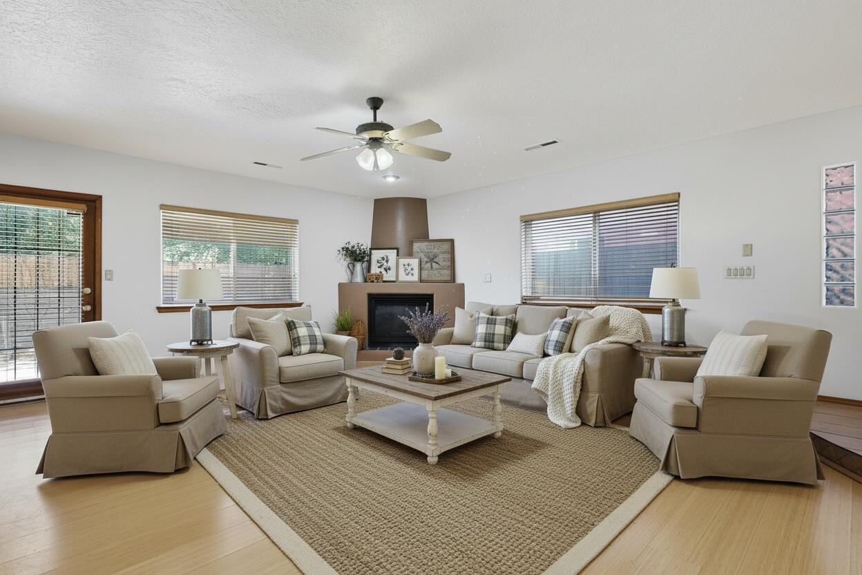 This thoughtfully designed custom residence has been updated with a newer roof and fresh interior paint. Ideally located just minutes from charming local cafes, dining options, and quick I-40 access, you'll appreciate the easy lifestyle of North Valley and Old Town proximity. Inside, the open kitchen seamlessly connects to a spacious great room accented by a warm corner gas fireplace. Recent improvements include a new microwave, new dishwasher, and a new boiler to support efficient radiant heating. Each bedroom features a ceiling fan, and the private primary suite boasts its own balcony, dual sinks, and a roomy walk-in closet. The low-maintenance backyard enhances effortless outdoor enjoyment. This home delivers comfort, quality, & location--schedule your tour today & make it yours! No HOA