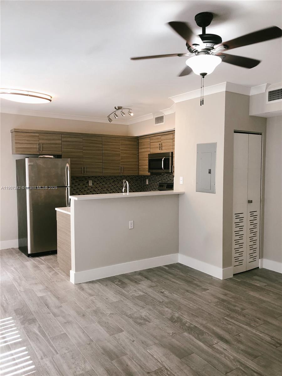 Move-In Ready 1/1 in the heart of the City Beautiful! Modern updated kitchen featuring SS Appliances, white quartz countertops, contemporary cabinets & sleek tile backsplash. Central AC, spacious closet, washer and dryer *IN-UNIT*! Ceramic wood-look tile throughout, chrome hardware, white crown molding. Plenty of natural light. First floor unit! Entire building has Hurricane Impact windows & doors, as well as 24-Hr Video Surveillance. Street parking only. 1 Pet allowed up to 35 lbs with non-refundable pet fee. Rent covers water, sewer, trash removal, pest control. Please TEXT ONLY for any questions. Please request showing via Showing Assist. Credit 650+. First Month Rent, Last month rent, $1000 Security Deposit.