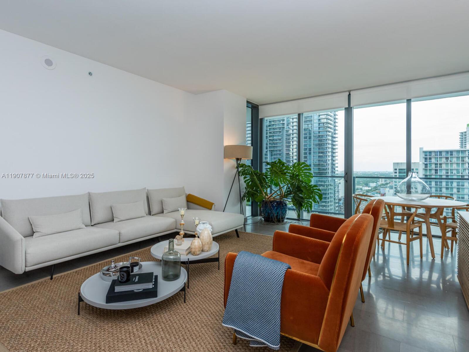 Nestled in the sought-after Reach at the Brickell City Center, this contemporary unit features 3 bedrooms plus den, 3 full and 1 half bath. Showcasing 1, 660 Sq. Ft. of bright living spaces with an open floor plan, the kitchen has modern Italian cabinetry. The main suite has a spa-like bath and beautiful views from a spacious balcony which is accessible from every room. Italian custom made closets in every bedroom. Stellar amenities include a half-acre amenity deck featuring tropical gardens, BBQ grills, state-of-the-art fitness center, a children's play area, heated lap and social pools, a library, business center and a full-service spa. With the added convenience and luxury of having an adjacent sophisticated shopping mall, discover a lifestyle blending sophistication with city allure.