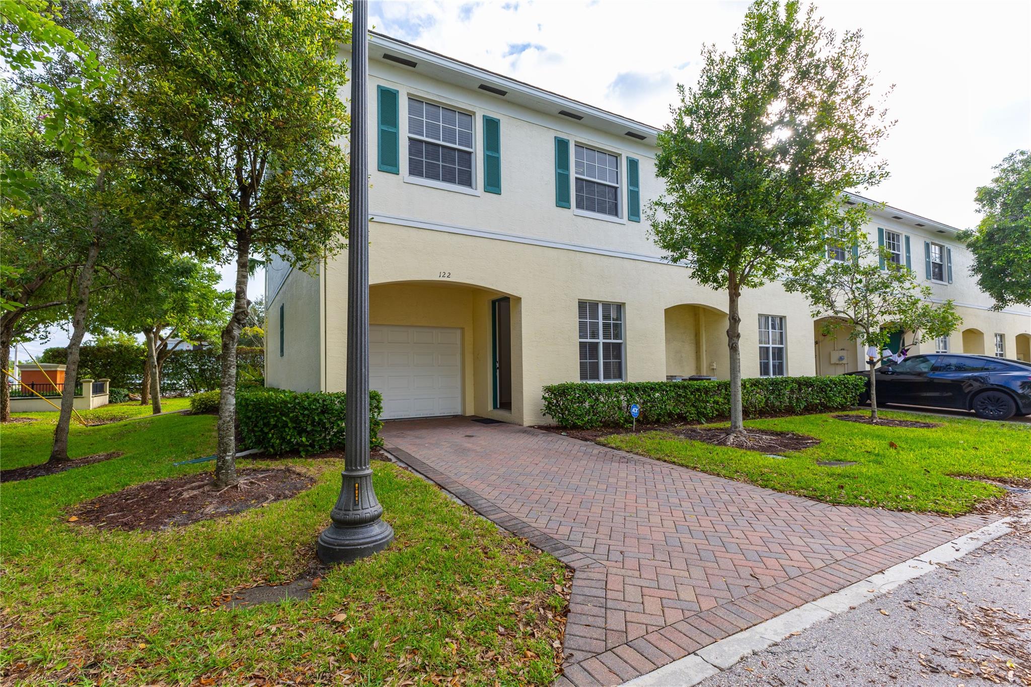 Prime location and convenience in the heart of Pompano Beach! This spacious 3 bed/2.5 bath corner townhome is just off of E Atlantic Blvd. 10 minutes from the beach, restaurants, shopping, I-95 and Publix! Featuring tile flooring, an open concept kitchen with stainless steel appliances, over 2,000 square feet of living space, tall ceilings, and custom walk-in closets. Perfect for entertaining with a bright, open layout and amenities that include a pool, fitness center, clubhouse, and trails along the lake as well as a low HOA fee that maintains your exterior, including you roof and lawn for a peace of mind. Beautifully maintained, move-in ready, and priced to sell!