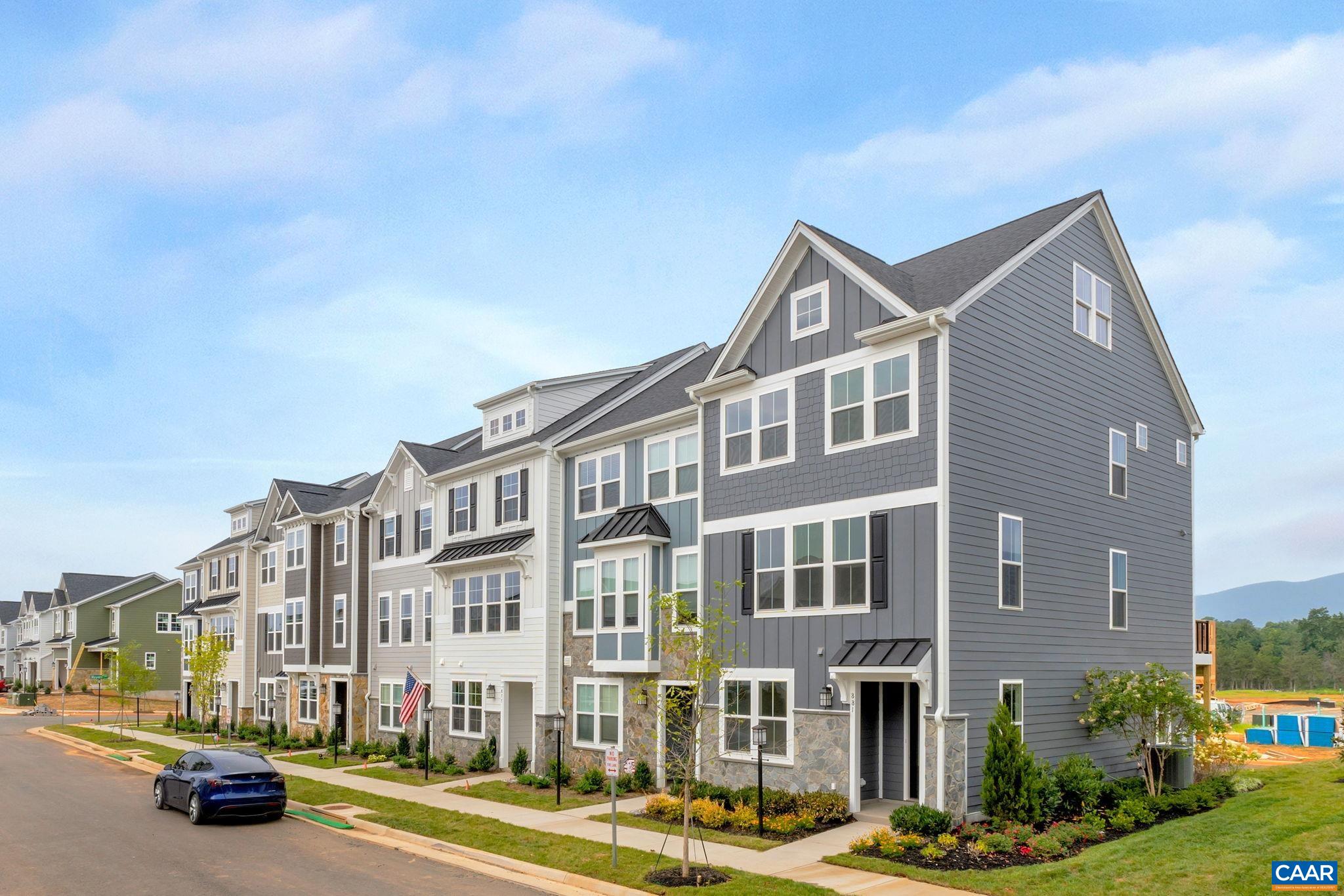 Almost completed - photos coming soon! Discover the Holly II, a beautifully designed three-story townhome in the newest section of Belvedere. This stunning home offers a spacious and flexible layout, starting with a rec room and half bathroom on the first floor, perfect for a gym, office, playroom or den. The second floor’s open-concept design features a large kitchen with a walk-in pantry, a generous dining area, and a sunlit family room, ideal for entertaining or everyday living, plus an additional half bath. Upstairs, the primary suite provides a retreat with a luxurious en suite bath, while two additional bedrooms share a well-appointed hall bath. The laundry is conveniently located on the third floor, making household tasks a breeze. Thoughtful upgrades like oak stairs with open railings and gas appliances add both style and functionality. A rear two-car garage offers parking and extra storage.  Belvedere offers an array of amenities, including access to parks, close proximity to the Rivanna trailhead, the nearby SOCA Fieldhouse, a dedicated dog park for pet owners, and enchanting playground areas.  Photos are of similar home and may show optional upgrades.