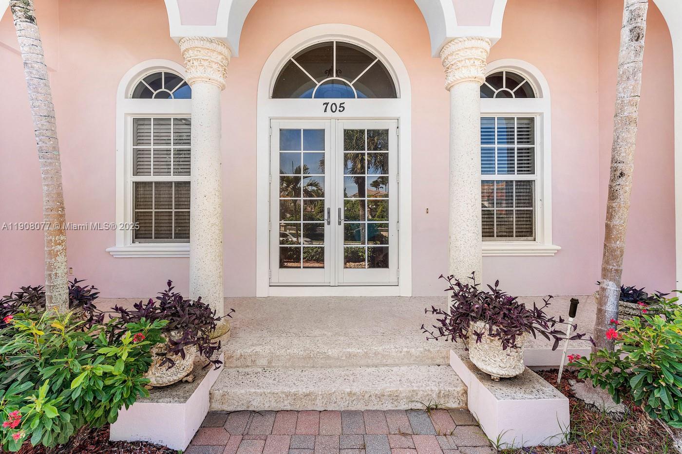 Single story home directly across the street from the Atlantic Ocean in Juno Beach. This beautifully custom-built and well-maintained home on a corner lot offers custom design, high ceilings, large rooms, plenty of light, 3 bedrooms, 4.5 baths, large kitchen with breakfast area overlooking courtyard pool. Split plan primary suite with his and her baths. Guest bedrooms are on-suite. Marble floors and custom moldings throughout. Large laundry room with cabinets for extra storage. Freshly painted inside and out, pavered drive, large 2 car garage with shelving, new AC, 2026; new pool heater to be installed, new hot tub cove.r Walk across the street via a direct path to the ocean. Vacant, Easy to see.