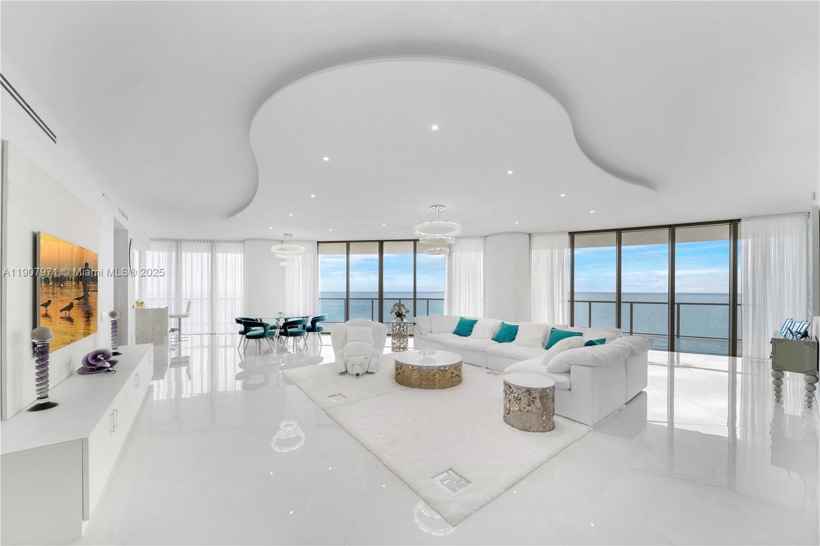 Experience unparalleled Luxury & Sophistication at the St. Regis Bal Harbour Center Tower Residence w 180 degree Panoramic Direct views of the Atlantic Ocean! This completely Remodeled 3/3.5 bath residence spans an expansive 2,721 SF Interior plus 1304 SF wrap around Terrace .Contemporary designed Impeccably renovated with Top-quality European materials, this unit stands as pinnacle of elegance. Custom-made Italian kitchen & Closets. Italian porcelain 10'x3' slabs grace the floors, Miele appliances elevate the gourmet experience, while Infrared Sauna in the Master Bath beckons relaxation & rejuvenation. Ultimate Luxury 5-star Resort Amenities include REMEDE Spa ,Hair Salon,Fine Dining with Residents discount , Full Beach & Pool service ,Fitness Center, Residents Consierge & Car Service