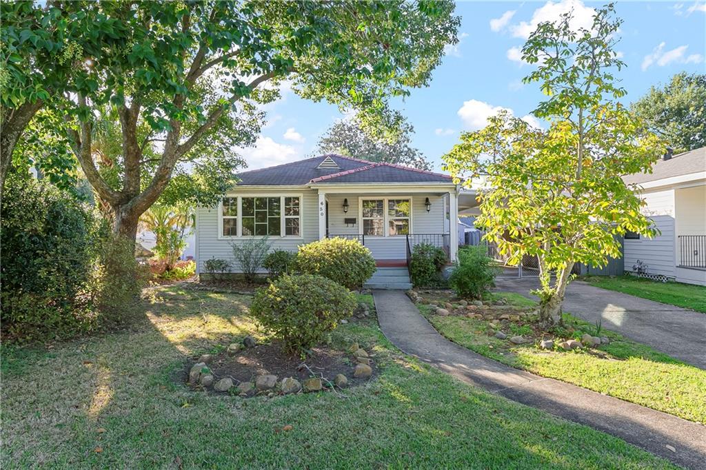 Wonderful cottage on a beautiful tree lined street with an inviting front porch, side carport and garage.  Beautiful wood floors throughout the house.  Lots of windows for an open and airy feeling.  Lovely screed back porch off the primary bedroom. 
Great single car garage with lots of storage. Large master bedroom that could also be used as a den/living area.  Home has very large closets for great storage.  This is a raised home located in an X flood zone. Large utility room.
This home has so much to offer! Hurry, this will not last long.