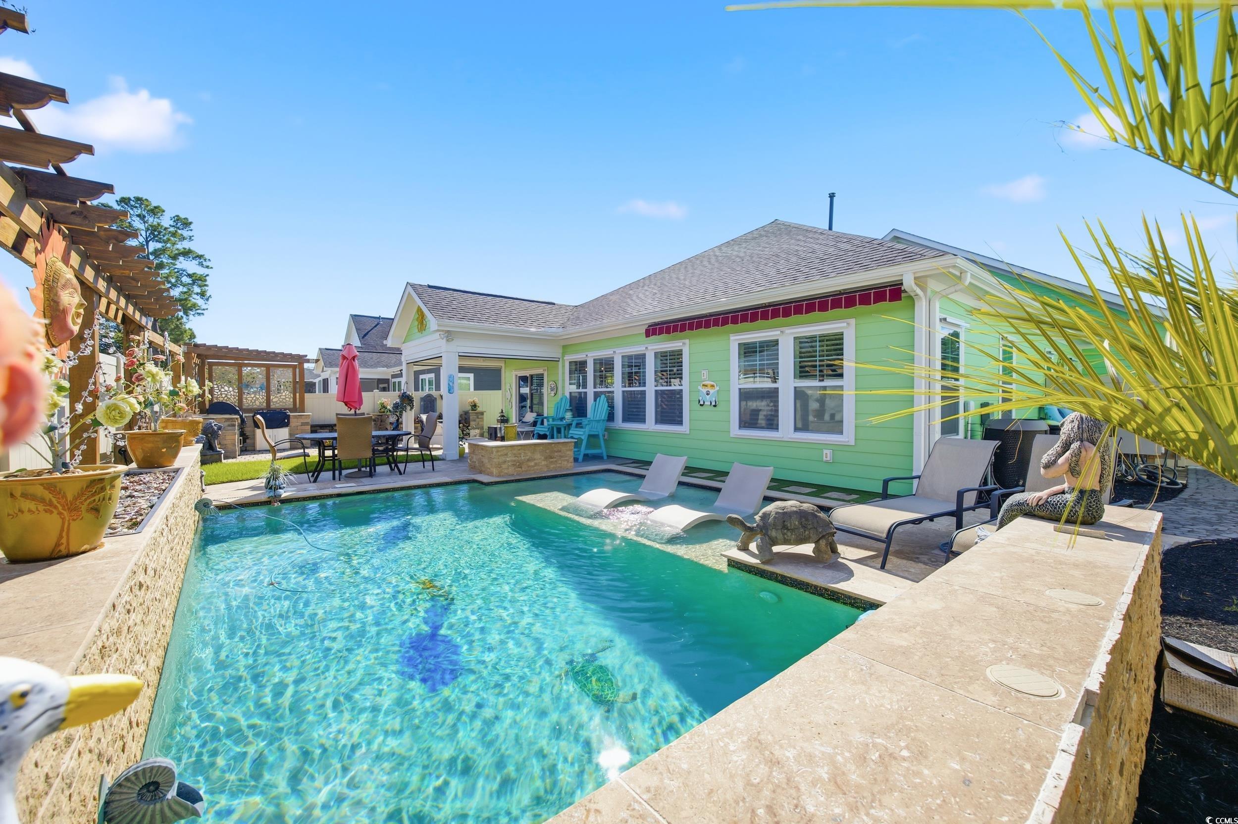 Outdoor pool with a patio, outdoor dining area, a pergola, and an outdoor living space
