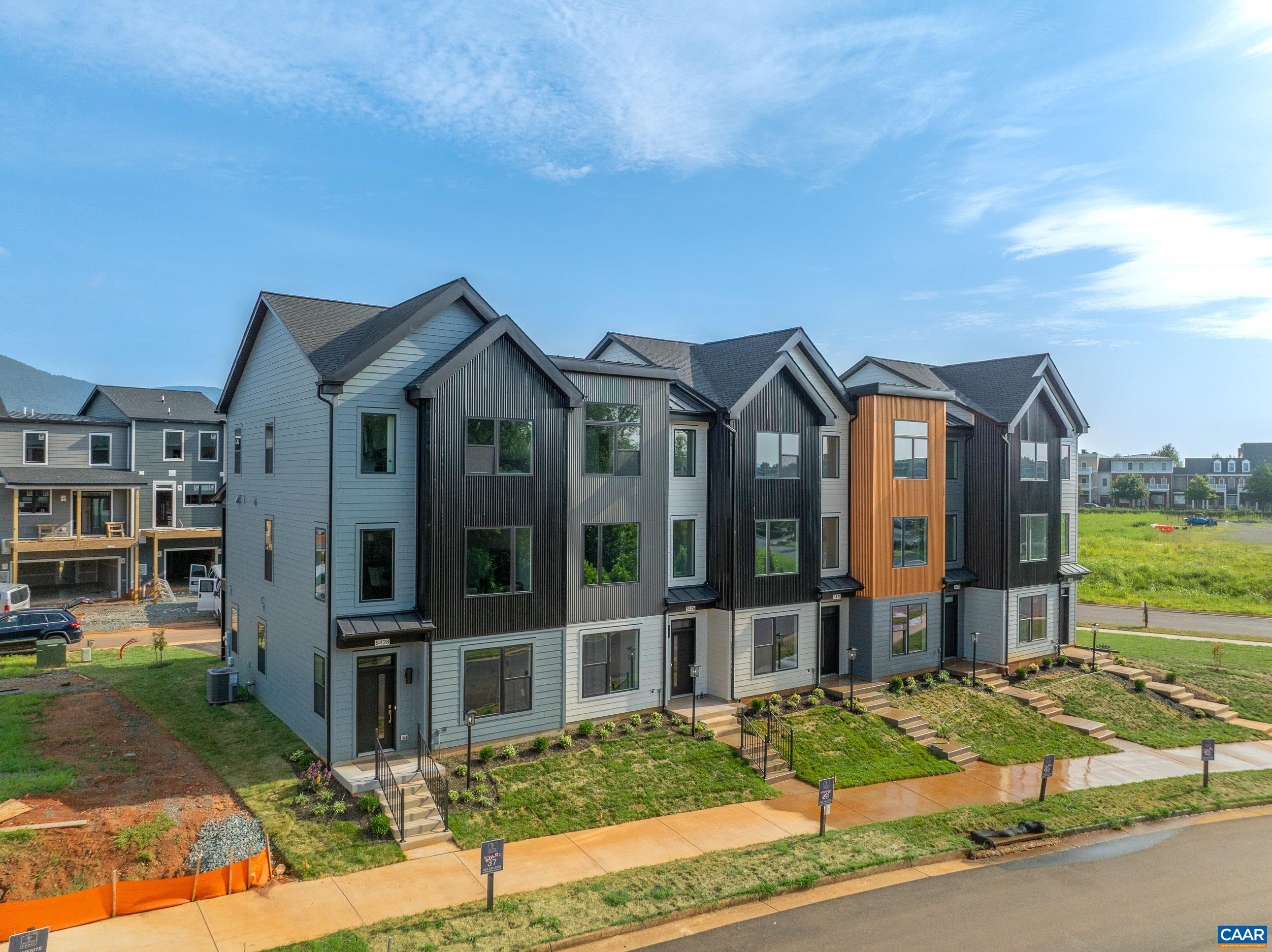 Proposed. The Cameron, a brand new contemporary townhome design in Old Trail. The entry level offers a flex space or home office with an attached one car garage. The main level has a well-appointed L shape kitchen with pantry, living room, half bath, dining, and available deck complete this level. The bedroom level includes dual suites, laundry & linen closet. Premium exterior finishes: James Hardie & metal siding, metal roofing, dark bronze windows, and composite decking. Old Trail is set against the Blue Ridge mountains steps from dining, coffee shop, ACAC Gym, golf course, schools and more! Every home is Pearl GOLD Certified and HERS scored by a third party to ensure quality, comfort, & energy efficiency.