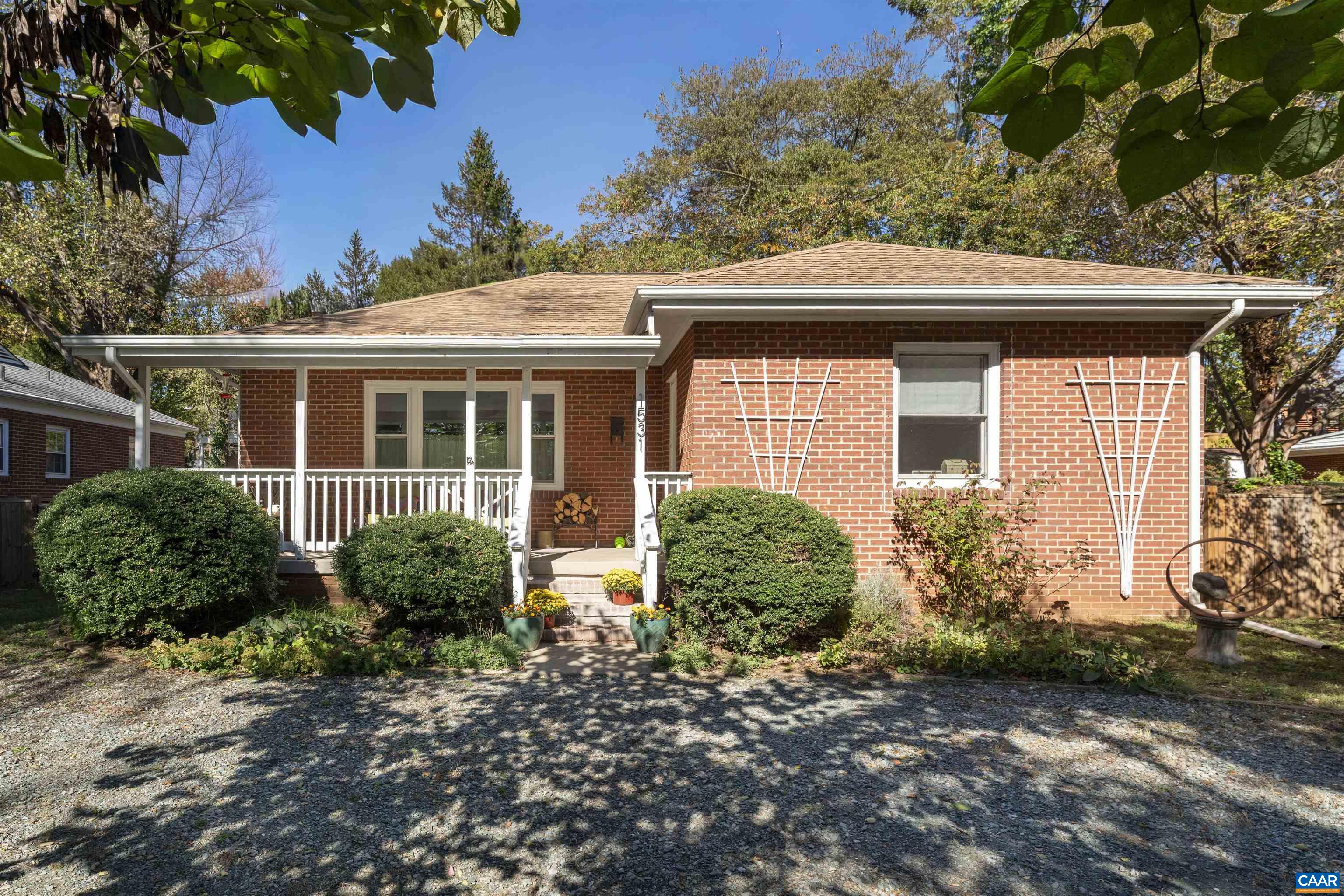 OPEN HOUSE SATURDAY 11/8 from 12-2pm. Nestled in the heart of Rugby Hills, this charming brick bungalow has been thoughtfully renovated by architectural designers and artists, blending character and creativity at every turn. From the curated finishes to the modern updates, this 3-bedroom, 2-bath home (plus a finished basement family room flex space) is full of warmth and style. The main level features a classic wood-burning fireplace, original hardwood floors, and ample natural light from replaced windows. The kitchen, basement, and bathrooms were renovated between 2020–2022 with an eye for both function and form; think custom cabinetry, herringbone tile floors, sculptural lighting, solid wood interior doors, and playful color throughout. Downstairs, a finished family room with a kitchenette offers space to stretch out; ideal for guests, movie nights, or creative pursuits. Outside, enjoy a fenced-in and level back yard in a walkable neighborhood just blocks from Greenleaf Park, Walker Elementary, and the Preston Avenue corridor, all within Trailblazer Elementary district. Timeless yet creative, practical yet full of personality; this home is a rare find in one of Charlottesville’s most loved neighborhoods.