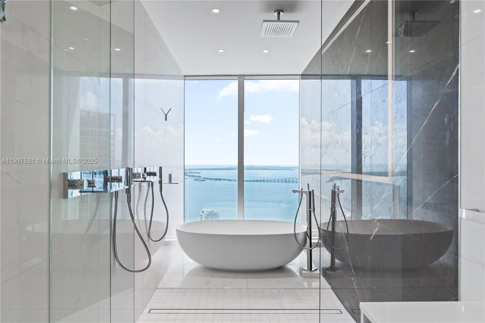 Introducing The Sky Residence 5003, a distinguished 3-bedroom + den, 4.5-bathroom residence on the 50th floor of the new Aston Martin Residences in Downtown Miami. This flow-through unit offers unparalleled, breathtaking views over Biscayne Bay and the vibrant city skyline. Inside features a private elevator foyer, Bulthaup kitchen outfitted with premium Gaggenau appliances, and a separate staff quarters with full-sized washer & dryer & full bathroom. The expansive layout also includes an oversized balcony, open living & den. Residents benefit from an exceptional downtown location and enjoy access to four levels of world-class amenities, including indoor and outdoor pools, a two-story state-of-the-art fitness center with yoga and boxing studio, spa, golf simulator, art gallery, and more.