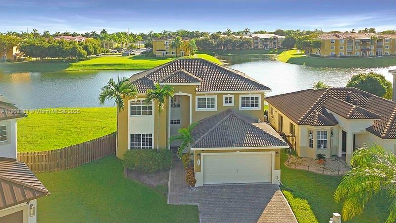 Beautiful 4-Bedroom, 3 bath Lakefront home in Cutler Bay*Enjoy serene lake views-The first  floor features elegant tile flooring, while the second floor offers a warm, wood-like finish for a cozy touch*The open floor plan is perfect for entertaining, with plenty of natural light and modern finishes throughout!