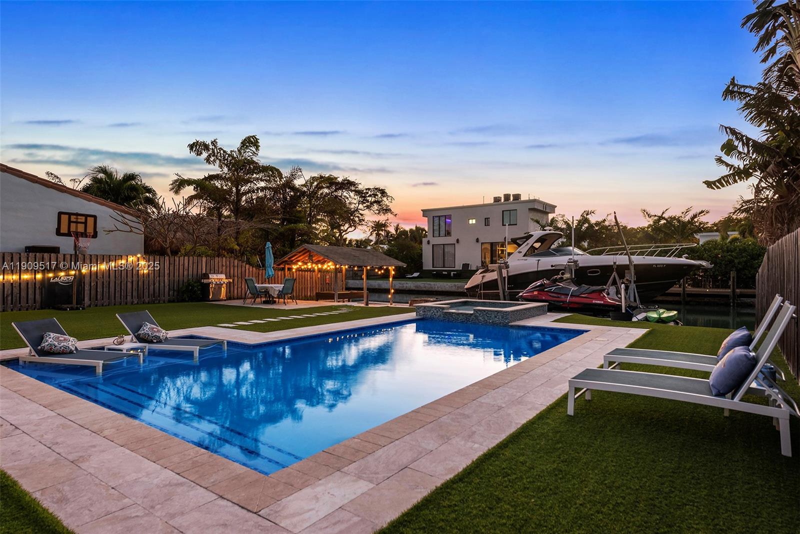 Welcome to your waterfront paradise in this beautifully renovated 4-bedroom, 2-bathroom home in Miami Beach. Offering 2,576 SF of living & entertainment space, 60 feet of water frontage, no fixed bridges, & a stunning backyard oasis just steps from multiple parks & the beach. This bright & airy home features an updated kitchen, modern flooring, & renovated bathrooms. The open floor plan offers multiple entertaining spaces that flow seamlessly to the oversized backyard retreat, complete w. a pool, spa, & expansive green space perfect for hosting or relaxing. The home features full impact glass throughout, new paint, updated plumbing, & a 16,000 lb boat lift. With direct ocean access, & close proximity to Bal Harbour Shops and more, this home & location offer the best of Miami Beach living.