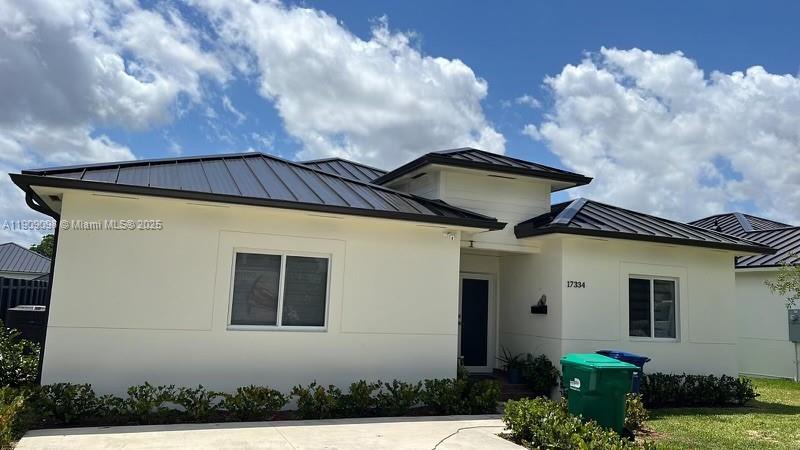 For rent in the heart of Homestead — spacious single-family home with no HOA, featuring a 4-bedroom, 2-bath main home plus a 1-bedroom, 1-bath in-law suite with a private side entrance, perfect for extended family or guests. This beautifully finished residence offers an open-concept floor plan with high ceilings, large modern tiles throughout, a wrap-around kitchen overlooking the private fenced backyard, elegant bathrooms with floating vanities and lighted mirrors, a full-size laundry room, and impact windows and doors for peace of mind.