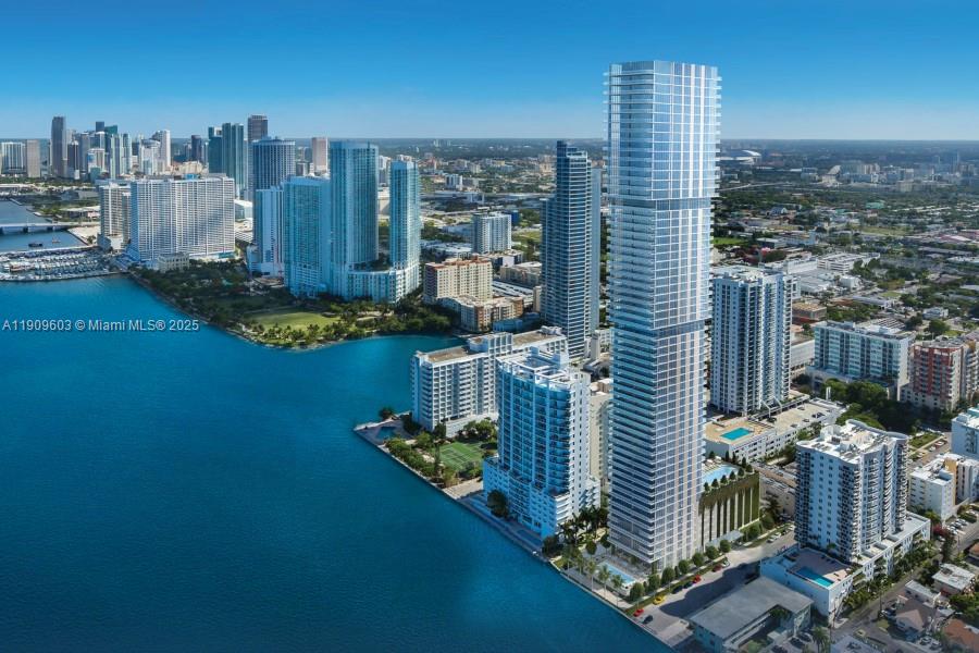 Indulge in luxurious living in this stunning southeast flow-through corner unit at Elysee, offering magnificent sunrise and sunset views. This spacious residence features elegant porcelain floors throughout. The primary suite, located off the living room, overlooks Biscayne Bay and includes a spa-like bathroom with a walk-in shower and soaking tub. Expansive terraces on both the east and west sides provide generous outdoor space for relaxing or entertaining. Elysee offers exceptional amenities and is perfectly situated just minutes from the Design District, Brickell, the Performing Arts Center, Midtown, Miami Beach, and Miami International Airport.