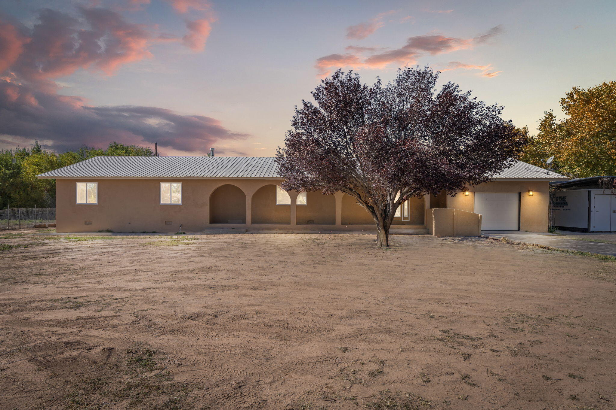 Stunning craftsmanship and thoughtful updates define this remodeled 3 bed, 3 bath home in unincorporated Bernalillo County. The 2,108 sq ft main house plus 547 sq ft finished Casita/Flex building offer over 2,900 sq ft of style and comfort. Enjoy an open, sunlit layout with a stacked-stone fireplace, granite kitchen, butcher-block island, and stainless appliances. Features include new flooring, fixtures, and paint, city sewer, 2-car carport, and space for all your toys. Experience peaceful country living under dark skies--see it before it's gone!