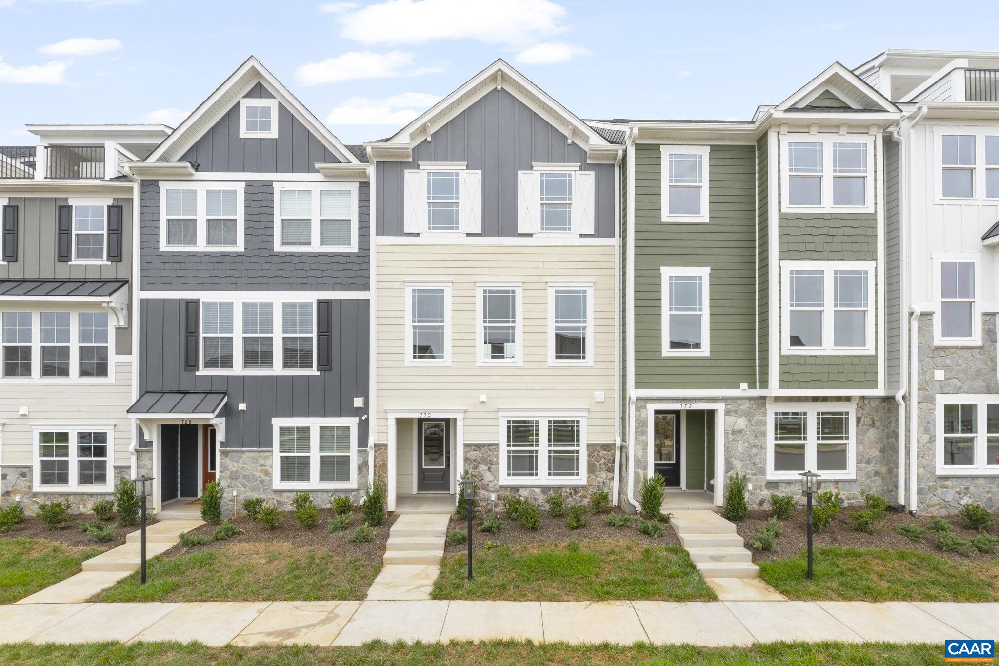 Just completed - actual photos! This Poplar II townhome in Glenbrook offers a comfortable, farmhouse-style layout surrounded by mountain views, green spaces, and walking trails—all within easy reach of downtown Crozet. This interior unit features a bright kitchen with plenty of prep room and a walk-in pantry, a spacious rear deck off the main level, and a first-floor bedroom with its own full bath that works well for guests or a home office. You'll find thoughtful touches throughout, like oak stairs, solid core interior doors, wood shelving, and an energy-efficient furnace. A two-car garage is included for added convenience. Community perks include a nearby path to Crozet Park and future access to downtown via a planned trail.