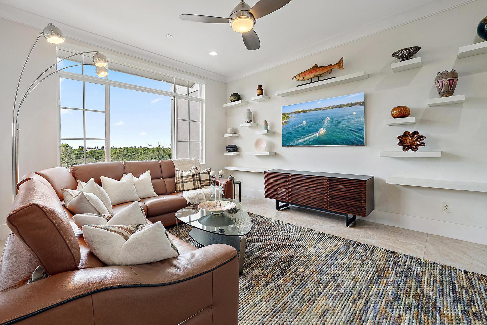 Discover this gorgeous one-of-a-kind residence in Tierra Del Sol, an exclusive gated enclave of just 20 residences. Nestled minutes away from the ocean with direct access to Jupiter's scenic Riverwalk, this community offers the ultimate coastal lifestyle with serene preserve views and sunsets that will never disappoint. This unique 4-bedroom, 3.5-bath townhome spans over 3,400 sq. ft. across three levels and features a private elevator for easy access to all three stories. With a desirable east and west exposure, the interiors are bright and airy, pairing elegance with function:10-11 ft. ceilings, white oak engineered wood and porcelain tile floors, crown molding, custom baseboards, motorized shades, plantation shutters and impact windows and doors. Multiple balconies on each floor invite you to enjoy daily sunrise and sunset views.
The chef's kitchen impresses with Bosch appliances, a gas range, oversized granite island, custom pull-out pantry drawers, a built-in corner lazy-susan and a 200+ bottle wine storage unit. The primary suite offers a private balcony, custom walk-in closet, and spa-like bath with a free-standing tub and glass shower. A second en-suite on the third-floor functions as another master and offers a walk-in closet and Juliet balcony. The laundry room is conveniently located on the third floor.
Notable upgrades include a tankless hot water system with recirculating pump, whole-house water filtration with reverse osmosis, fire sprinkler system, five wall-mounted TVs, a central vac system and security cameras. The custom two-car garage is finished with isometric flooring, slat-wall storage, and custom cabinetry.
Just minutes from Jupiter's beaches, dining, shopping, and golf, Tierra Del Sol blends exclusivity with convenience. The COA-maintained exteriors, a heated community pool and spa make it a true lock-and-leave lifestyle.
Refined coastal living awaits&#x14;schedule your private tour today.