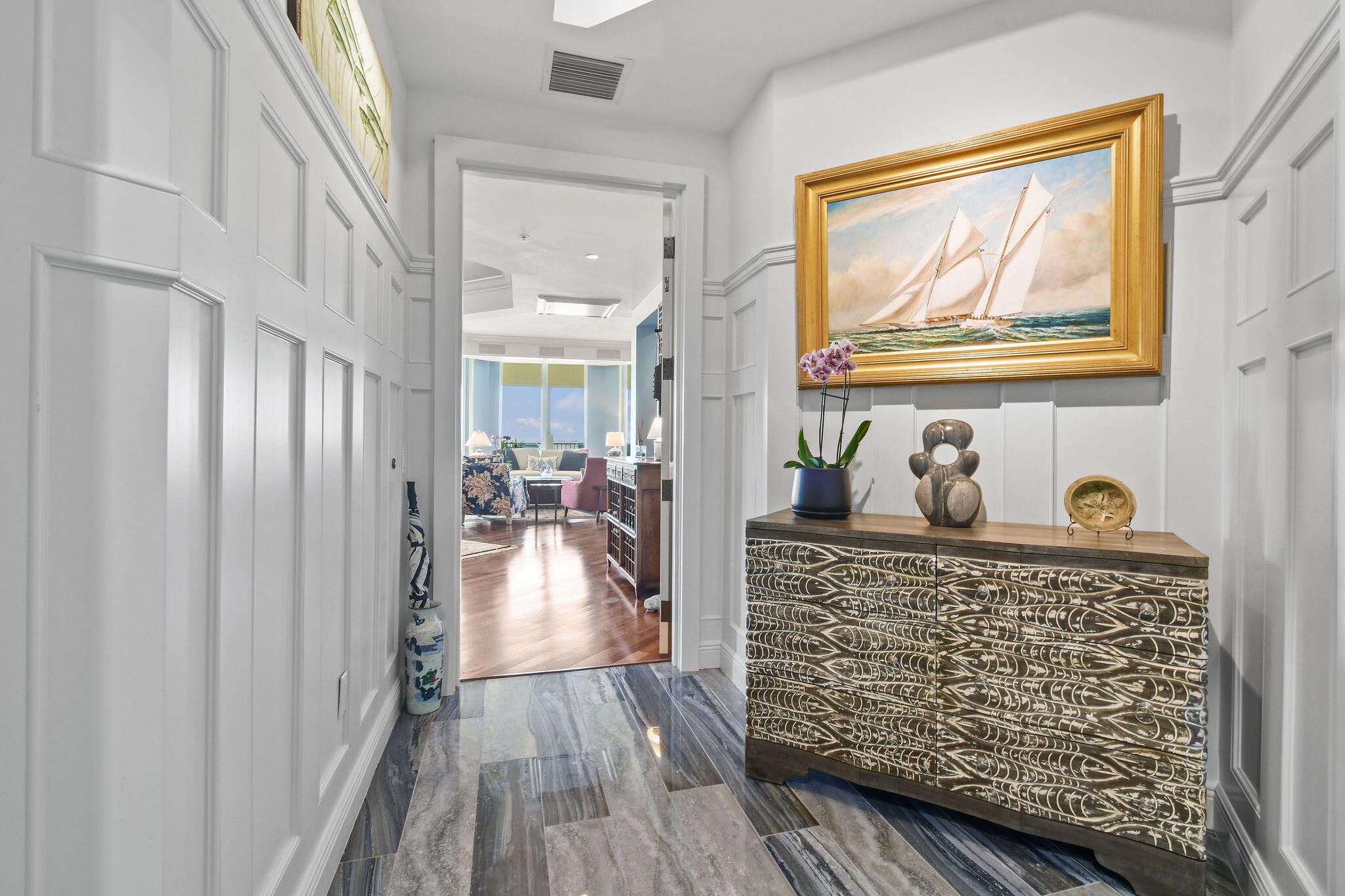 Experience luxury living at its finest in this stunning PENTHOUSE residence. With breathtaking water views from multiple rooms, this home offers an expansive wraparound terrace, where three rooms open directly to panoramic vistas of the Intracoastal Waterway. A private guest balcony also captures beautiful ocean views, adding to the allure of this exceptional property. Inside, enjoy the builder's showcased unit-upgraded mahogany wood floors, 10' ceilings, a gourmet kitchen, and elegantly appointed baths with custom tiles. Fine millwork throughout The spacious 3 bed/3 bath layout provides both comfort and sophistication. The elevator opens directly into your foyer, setting an elegant tone upon arrival and perfectly framing the natural beauty of Jupiter's waterways. Boat slips are available at the adjoining Yacht Club Marina, perfect for boating enthusiasts. Ideally located within walking distance to fine dining and entertainment, and just minutes from premier shopping, PBI Airport, and pristine beaches. This is coastal living at it's best&#x14;where sophistication meets the South Florida lifestyle.