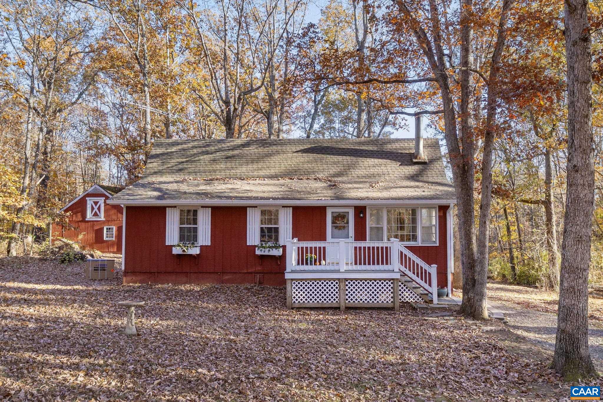 The Perfect Country Property! Welcome to your new home — a charming country home nestled on two level acres in a beautiful Albemarle County setting. This inviting property features a barn and chicken coop, ideal for small-scale farming or hobby animals. Perfect for a one horse farm. The bright, updated upper level offers an eat-in kitchen overlooking a spacious deck and private backyard, along with three bedrooms, a renovated full bath, and beautiful hardwood floors throughout. The walkout terrace level provides even more living space with a large family room, an additional bedroom, and full bath — perfect for guests, a home office, or multi-generational living. Recent updates include a brand-new heating and cooling system and a new roof (2020). Enjoy the peace of country living with the convenience of location — just minutes to Pantops, NGIC, Hollymead Town Center, Ruckersville, and the Charlottesville-Albemarle Air