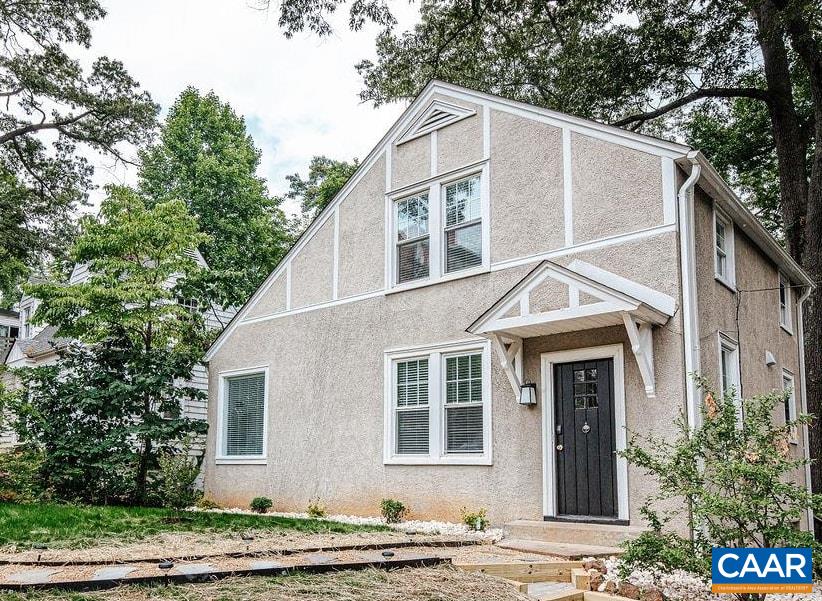 Idyllic cottage, comprehensively renovated, on University Of Virginia's doorstep. Tucked away down a quiet street yet a 5 min walk to Grounds. The main floor features a spacious foyer, inviting living room with a wood-burning fireplace, dedicated dining area, updated kitchen, full bathroom, and convenient laundry room. Heading upstairs you'll find three bedrooms, one of which features a built-in office nook, and a full bathroom. 1935 charm with original hardwood floors, handcrafted wood front door, classic hardware and trim throughout. Thoughtfully designed and decorated by local interior designer to have timeless appeal. Large lot with ample off street parking. R-B Zoning allows for more density. Currently rented through May 2026. A great investment property, weekend home, or full time residence for those wanting to be a stone's throw from everything UVA. Shown by appointment only.