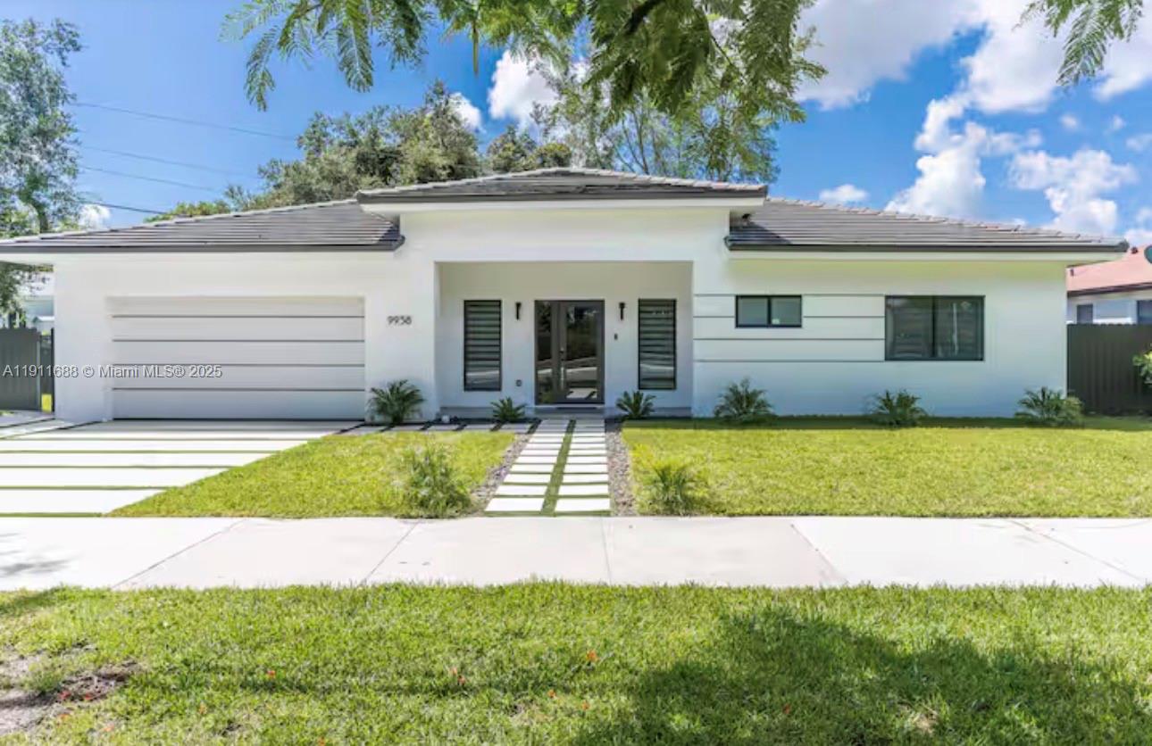 Experience modern living in this fully furnished 4-bedroom, 3-bathroom single-family home, showcasing sleek updated finishes and custom wood panel details throughout. The open-concept layout features a designer fireplace, stylish wine display, and spacious living areas that flow seamlessly outdoors. Enjoy your own private retreat with a sparkling pool and basketball court, perfect for both relaxation and entertainment. This turn-key residence comes complete with contemporary furnishings and decor. Water and cable included. Flexible lease terms available from 6 12 months. Please note: garage not included.