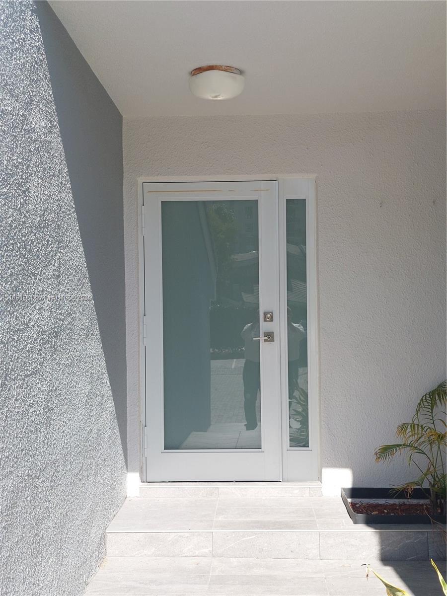 Spacious Waterfront Townhome on Poinciana Island. Gated, 3 car parking, 3 bed, 2.5 bath townhome with vaulted skylight ceilings, kitchen, marble floors, and a patio with slate floors and water views. one car garage plus assigned front parking. Deeded dock to unit, New roof, impact front door, airy, light-filled interiors. The ocean is across the street. Resort-style amenities include two pools, tennis courts, gym, clubhouse, and 24/7 gated security with patrol.  Water, sewer and trash included. HOA pays insurance, cable, and internet. Island-wide high-speed wireless connectivity, Enhanced security with cameras in all plazas, garages, and along the boardwalk, The location is unbeatable: just 15 minutes by boat to the Bal Harbour Inlet and sandbar and aventura mall is 15 minutes away.