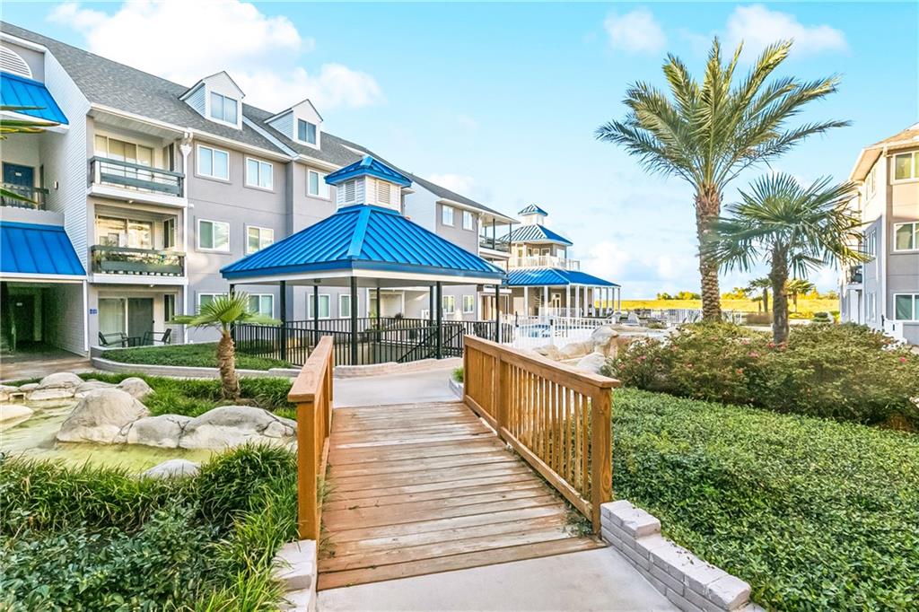 Resort-Style Living Near Lake Pontchartrain! Welcome home to this beautifully maintained gated condo community just minutes from the lakefront, marina, restaurants, and scenic walking/bike paths. This inviting unit features an open-concept layout with plenty of natural light and a private balcony. Enjoy relaxing evenings by the inground pool and hot tub, or entertain friends in the cabana and clubhouse. The property’s prime location combines tranquility and convenience, close to shopping and local dining, as well as easy access to Causeway and I-10. Whether you’re looking for a primary residence or a low-maintenance retreat close to the water, this condo offers the perfect blend of comfort, security, and coastal charm. Completely turnkey and fully furnished!