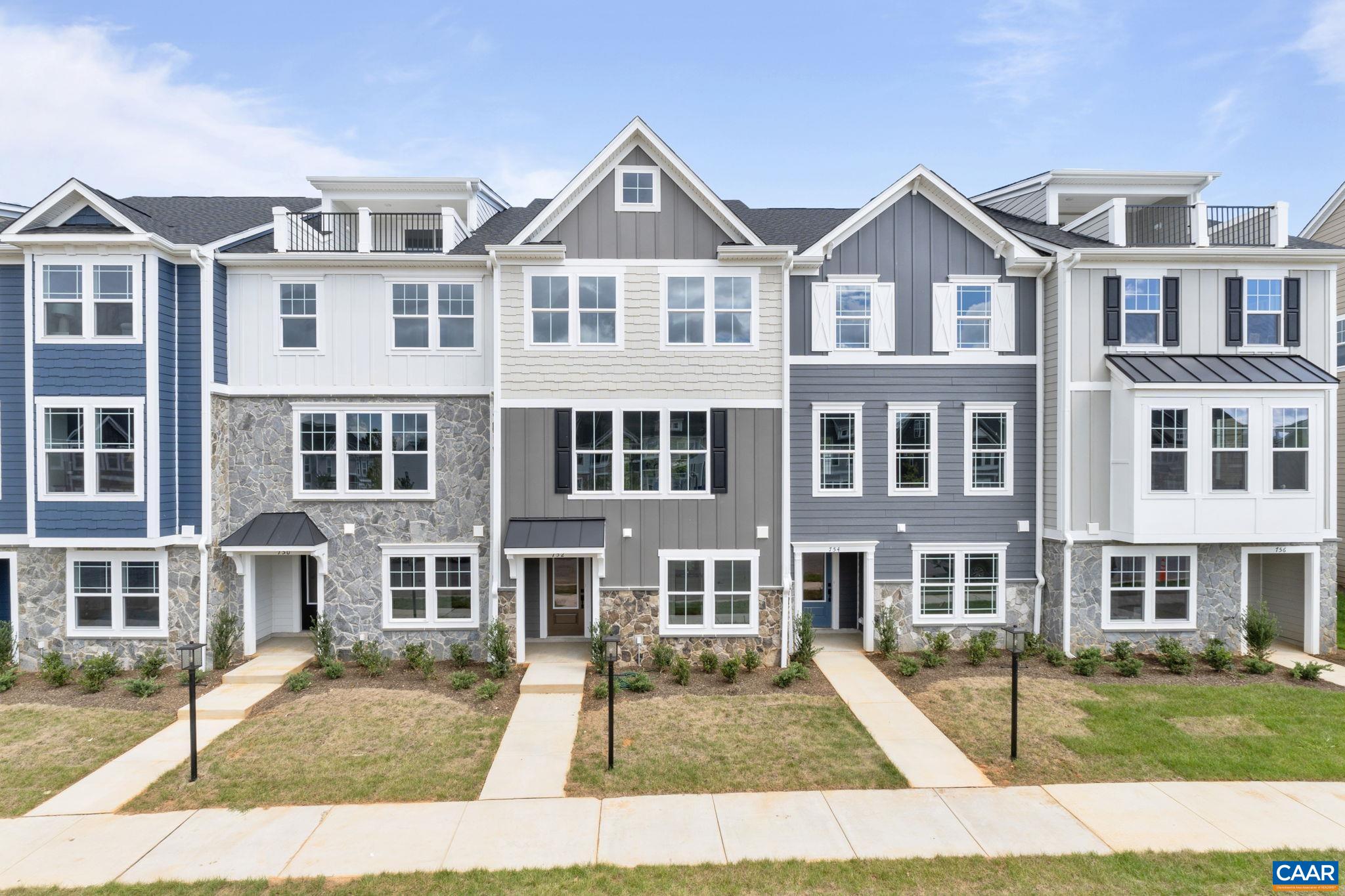 Just completed - actual photos! This Poplar II townhome in Glenbrook offers a comfortable, farmhouse-style layout surrounded by mountain views, green spaces, and walking trails—all within easy reach of downtown Crozet. This interior unit features a bright kitchen with plenty of prep room and a walk-in pantry, a spacious rear deck off the main level, and a first-floor bedroom with its own full bath that works well for guests or a home office. You'll find thoughtful touches throughout, like oak stairs, solid core interior doors, wood shelving, and an energy-efficient furnace. A two-car garage is included for added convenience. Community perks include a nearby path to Crozet Park and future access to downtown via a planned trail.