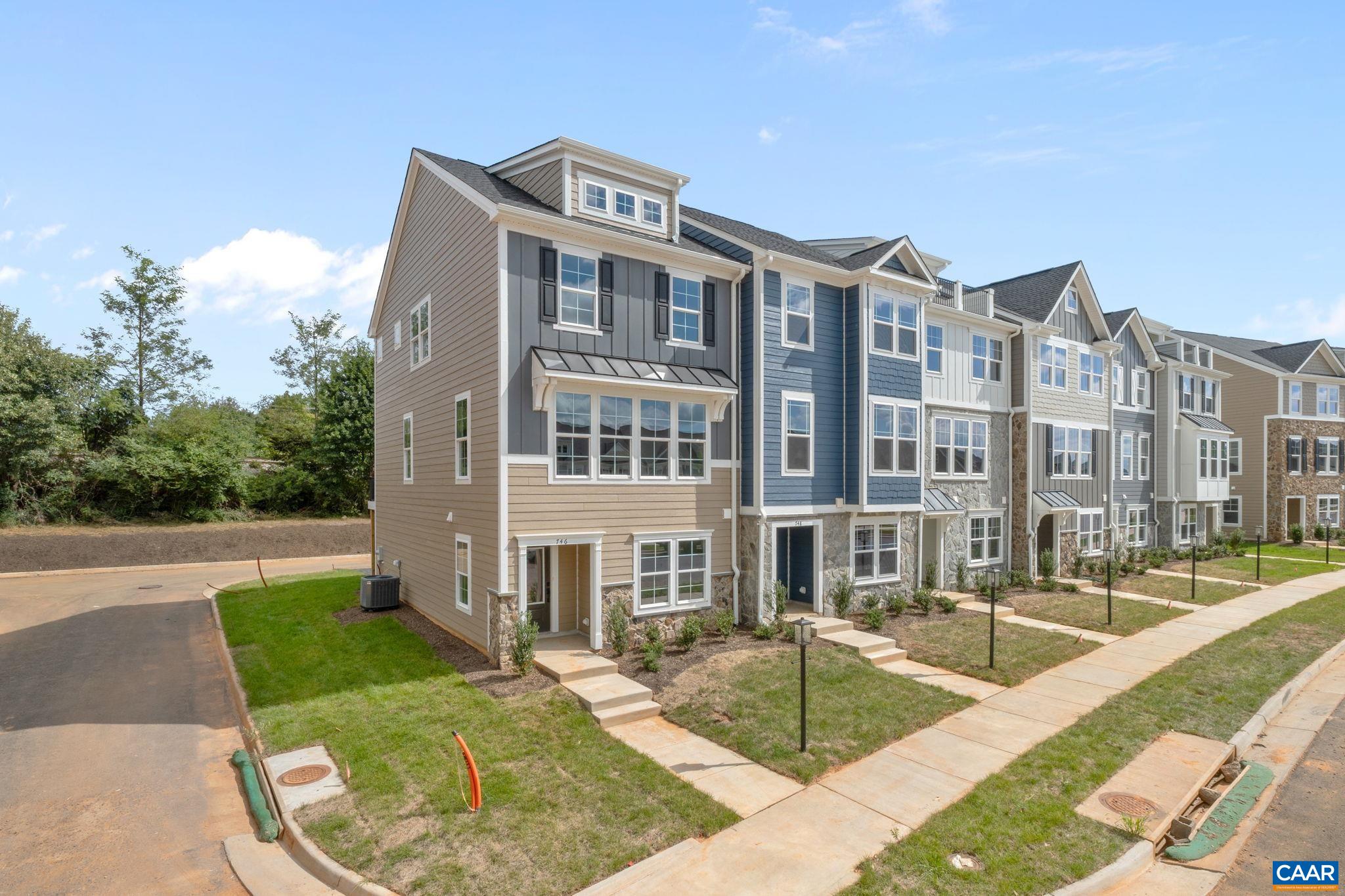 Just completed - actual photos! This end unit Poplar II townhome in Glenbrook offers a comfortable, farmhouse-style layout surrounded by mountain views, green spaces, and walking trails—all within easy reach of downtown Crozet. This interior unit features a bright kitchen with plenty of prep room and a walk-in pantry, a spacious rear deck off the main level, and a first-floor bedroom with its own full bath that works well for guests or a home office. You'll find thoughtful touches throughout, like oak stairs, solid core interior doors, wood shelving, and an energy-efficient furnace. A two-car garage is included for added convenience. Community perks include a nearby path to Crozet Park and future access to downtown via a planned trail.