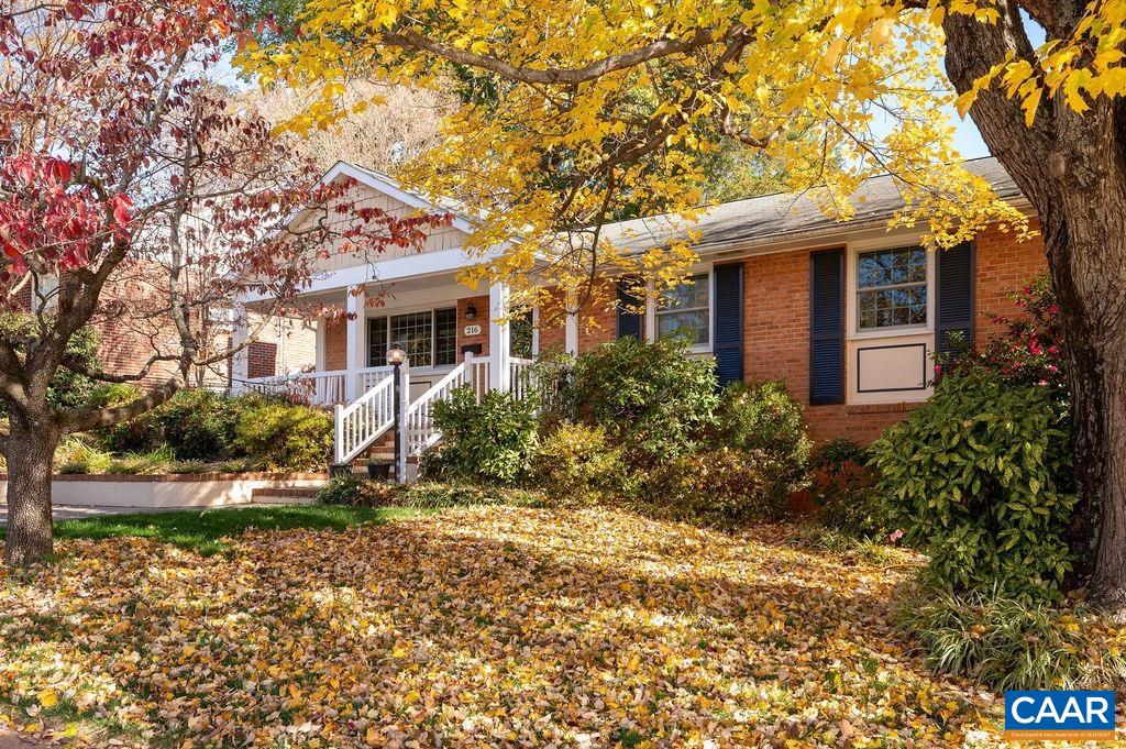 This charming 1965 brick ranch seamlessly blends classic character with thoughtful updates and a beautifully matched brick great room addition. Sunlight fills the spacious great room through walls of windows and elegant French doors leading out to two levels of deck that overlook the landscaped backyard & mountain views. Custom built-in cabinetry offers space for books and entertainment. Living Room has a wood burning fireplace that draws well. The fully renovated kitchen features granite countertops, stainless steel appliances, and a gas range. 3 main level bedrooms include a primary with an attached half bath. Full bath on the hall and the attached half bath have both been tastefully renovated. The bright, walk-out basement adds versatility with a large Rec Room and a cozy library/office lined with bookshelves. The office has a window and could become a 4th bedroom with a 2nd full bath also on this level. Unfinished space provides plenty of storage. Outdoor spaces shine with meticulously maintained gardens, mature trees, and a custom concrete driveway providing off-street parking. A charming front porch addition completes this inviting home. This home has been well loved and beautifully maintained by the same owners since 1979.