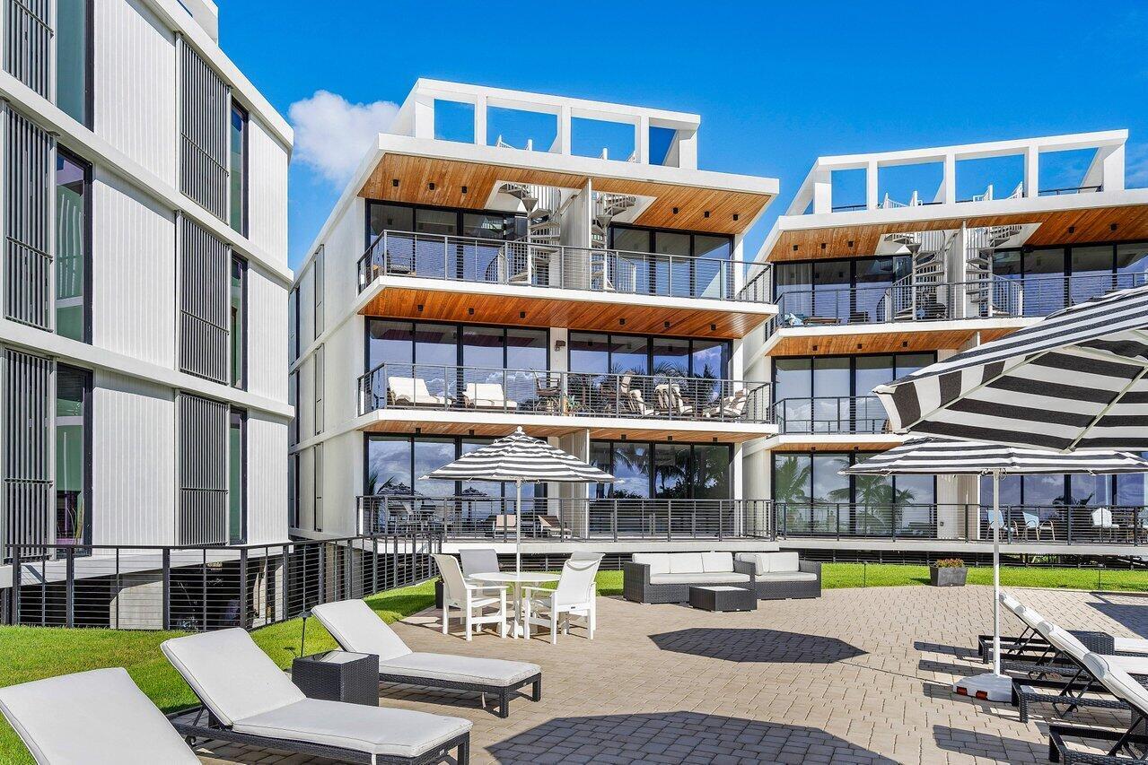 Enjoy sweeping south-facing views of the Palm Beach Inlet's crystal clear waters and Atlantic Ocean from this bright, modern residence in Ocean 18a''a boutique luxury building in Palm Beach Shores, known as the best little town in Florida. This 2-bedroom plus den (optional 3rd bedroom) features high-end finishes, a private elevator entry, impact glass, custom closets, a chef's kitchen with designer backsplash, and a stunning roof deck patio perfect for entertaining. Additional highlights include a spacious private balcony, covered garage parking, and a large storage unit. Amenities include a heated resort-style pool, fitness center, and secure entry. Just steps to the town's own private beach, inlet walkways and parks, Sailfish Marina, and nearby dining and shopping.