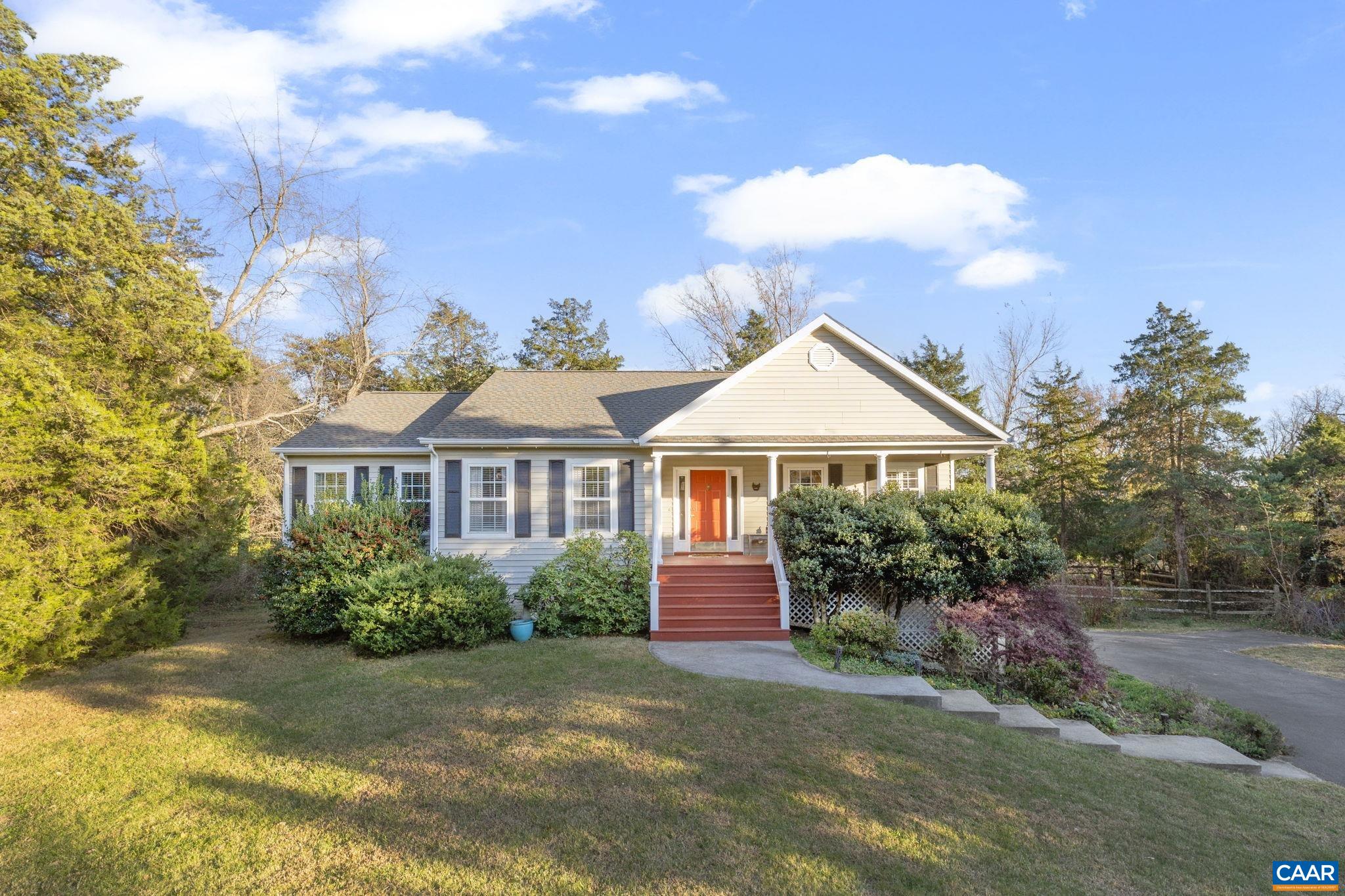 Enjoy easy, one-level living in the heart of Crozet—priced under $500K! This inviting ranch-style home on just over 1/2 an acre offers a basement with 1-car garage, vaulted ceilings, gas fireplace, open floor plan, and spacious bedrooms. Cozy living room is open to the dining area & kitchen. The primary suite includes dual vanities and a walk-in closet, creating a comfortable retreat at the end of the day. Basement space offers a family room with direct access to the spacious screened in porch overlooking the private backyard space, 4th bedroom (non-conforming), laundry, storage space & 1-car garage.  The property also includes a gated dog run, perfect for pets to play safely. HVAC & ROOF replaced in 2018, Water Heater replaced Oct. 2025. Nestled on a quiet cul-de-sac with no HOA, this home offers peace and privacy while still being walkable to downtown Crozet. With its desirable location, open layout, and value under $500K, this well-maintained Crozet home is a rare find that combines comfort, convenience, and charm.