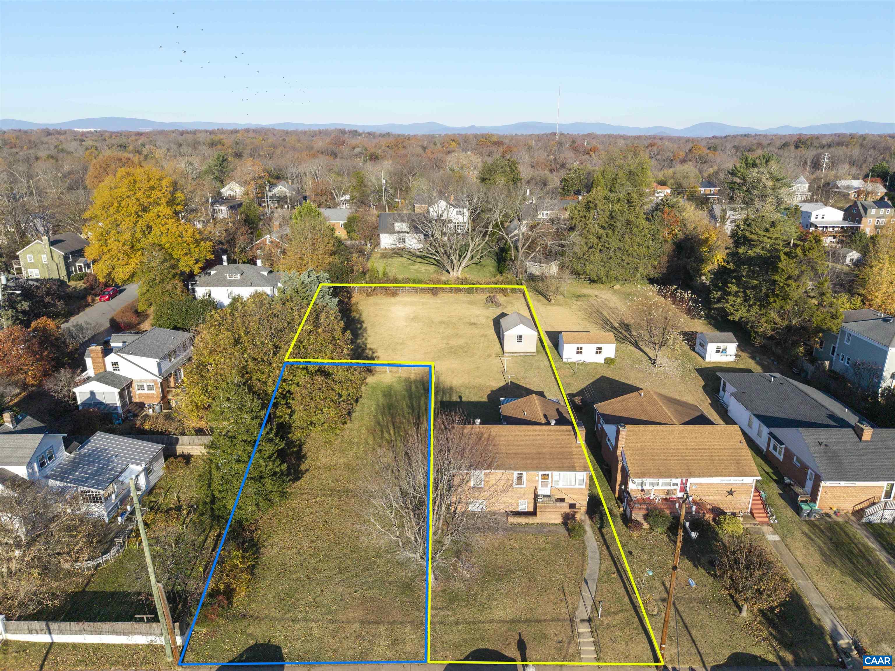 First time on the market and truly one of the kind! Situated on a 0.37 acre lot in Charlottesville's highly coveted Locust Grove neighborhood plus a 0.14 acre vacant lot that adjoins. This solid 3 bed/2 bath brick home has the ability to become so much more than what exists today. Some of the property's top features include : a wood burning fireplace in the living room, cedar lined closets, pristine Oak hardwood under existing carpet (protected all these years), newer vinyl windows, an oversized cinder block shed/workshop and exceptional views of Pantops Mountain from the backyard. The floorplan lends itself to finishing the basement level as more living space and another bedroom, or converting to an efficiency with its own entrance. The next owner is already half way there with the second full bath in place! The vacant lot could continue to be an oversized yard, serve as the spot for a garage with carriage house or another home - all sorts of possibilities! The Locust Grove neighborhood is minutes away from downtown Charlottesville, the Rivanna Trail, grocery shopping, restaurants, Sentara Martha Jefferson hospital and UVA medical center to name a few. This unique opportunity won't last, quick closing possible.