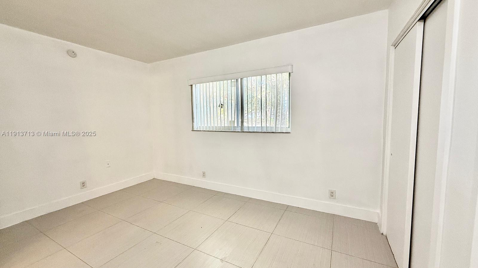 Well-appointed guest bedroom at 42 14th St - Condo in Dania Beach
