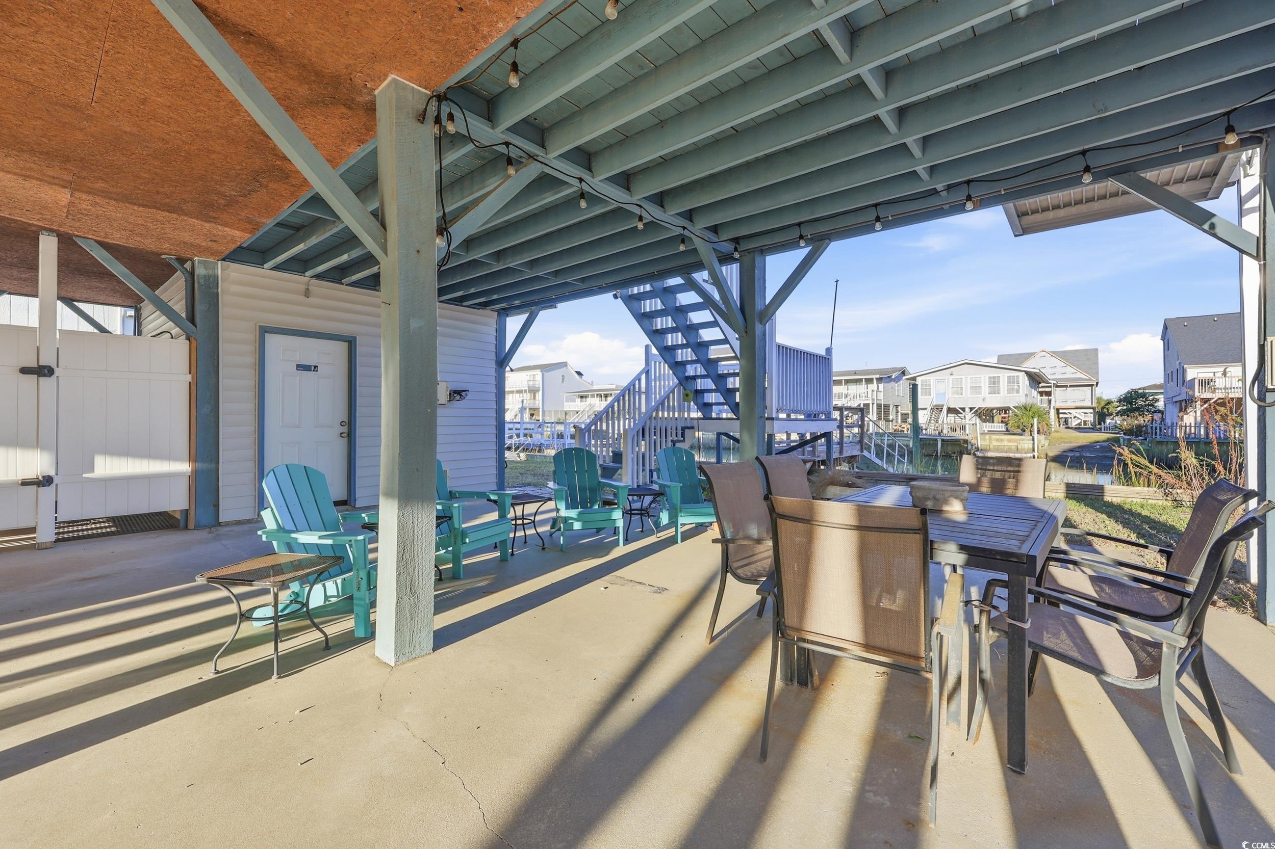 View of patio / terrace with stairway and outdoor dining space