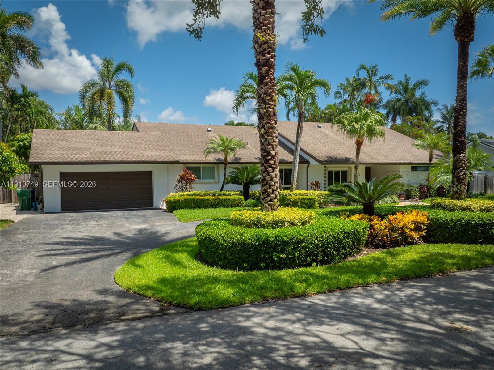 Live, gather and grow in this beautiful, impeccably maintained 4 bed /3.5 bath pool home located on a manicured 16,920 sf lot in Palmetto Bay, one of Miami’s most coveted neighborhoods. Generously proportioned, the living/dining area has vaulted ceilings, powder room and overlooks the pool & patio. The eat-in kitchen has granite countertops, ample cabinetry and wet bar. With 3218 adj sf, the well designed, one level split floor plan offers a primary suite, 2 bedrooms and cabana bath on the east wing and a separate junior primary suite on the west side. Features include impact glass, laundry room, 2 car garage, circular driveway, shed, covered patio, new septic/drain field & sprinkler system, flood zone X and great schools. Once you see it, you’ll feeling it could be your FOREVER HOME.