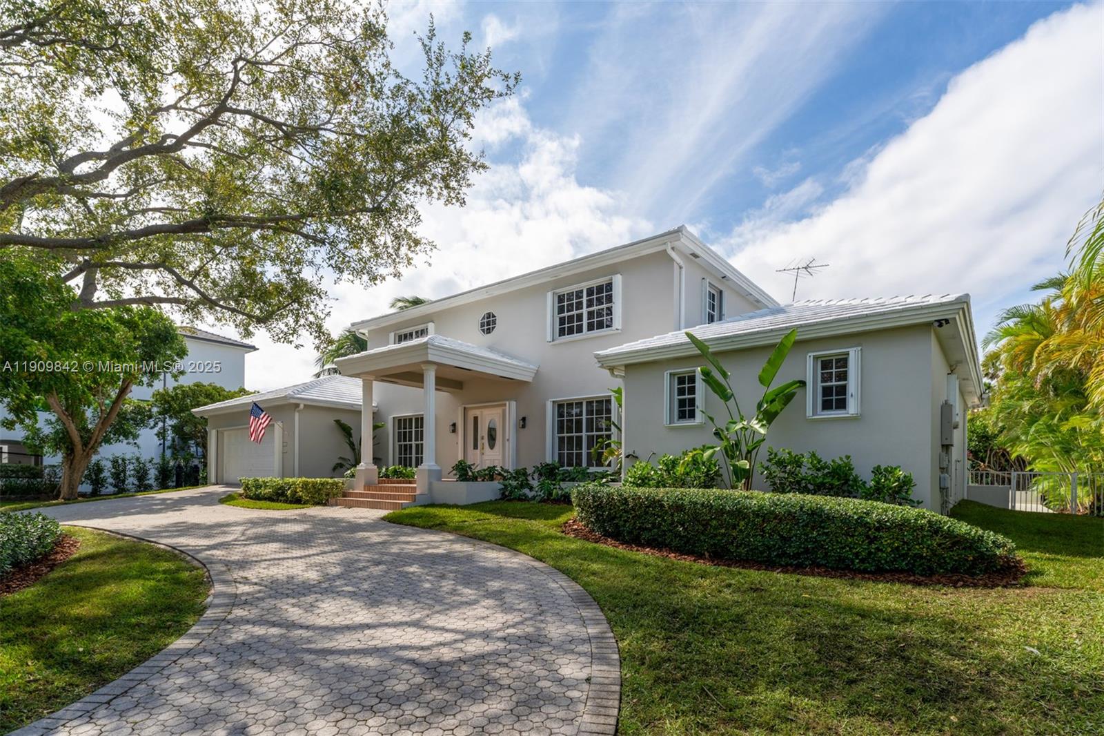 Discover elegant waterfront living in this Gables by the Sea residence on an 18,150 sq. ft. lot with no bridges to the bay. This 2-story 6-bedroom, 5-bath home features, primary suite on ground level, vaulted ceilings, skylights, and freshly painted interiors and exteriors that radiate warmth and sophistication. The open layout flows to a screened-in patio, ideal for entertaining or relaxing. A private 1-bedroom, 1-bath guest house with a kitchenette offers comfort for guests or in-laws. Enjoy ocean breezes, water views, a large dock with 30 amps connection with direct bay access, and close proximity to excellent schools.