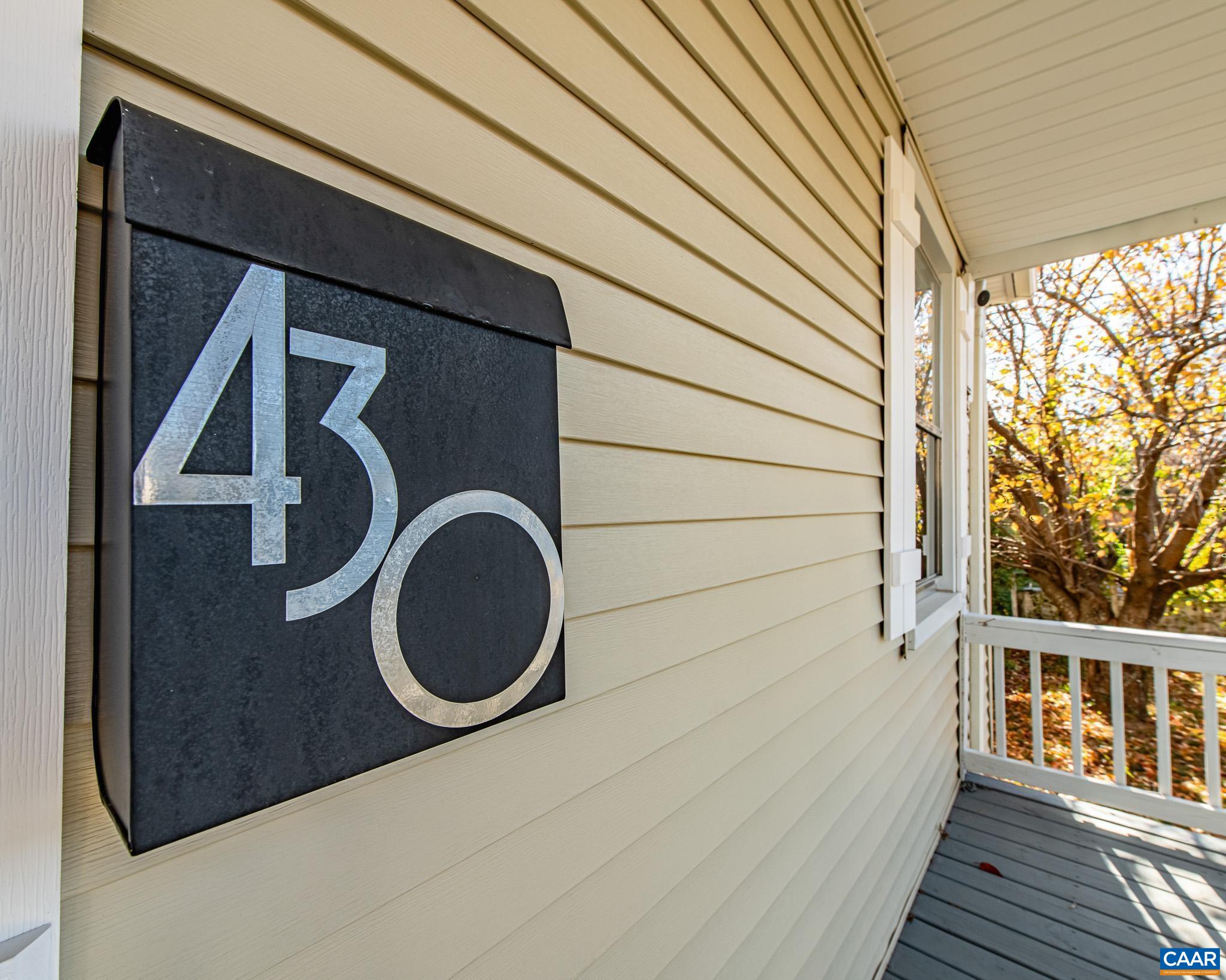 Bright and well-maintained home in the vibrant 10th & Page/West Street neighborhood offering exceptional access to UVA, the Downtown Mall, Dairy Market, parks, and bus lines. This corner-lot property includes alleyway access with off-street parking, a welcoming front porch, and mature landscaping that frames the home nicely. Inside, the freshly updated spaces highlight classic hardwood floors, wide room openings, and a practical built-in drop zone near the entry. The kitchen features modern cabinetry, granite counters, stainless appliances, subway-tile accents, abundant natural light, and a butcher-block work surface. The renovated full bath showcases a tile shower with glass enclosure, upgraded lighting, and a contemporary vanity. A dedicated laundry/mudroom adds convenience with storage and direct access to the rear of the property. This home provides a strong opportunity in a central Charlottesville neighborhood with room for future improvements and personal touches.