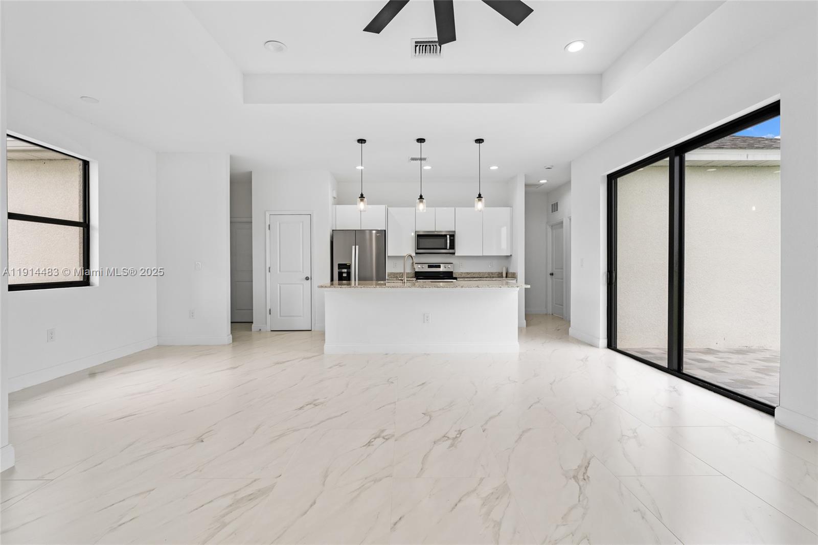 Open-concept living area at 933 GLEASON ST - Home in Lehigh Acres