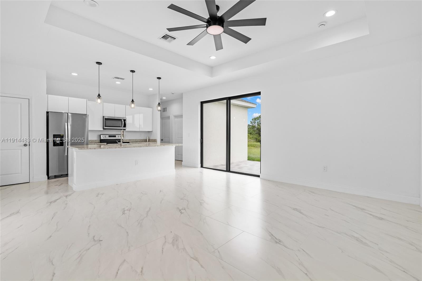 Modern kitchen with designer features at 933 GLEASON ST - Home in Lehigh Acres