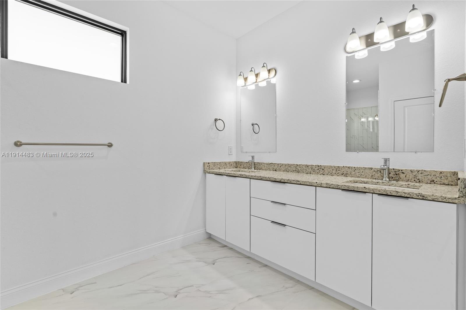 Well-appointed guest bedroom at 933 GLEASON ST - Home in Lehigh Acres