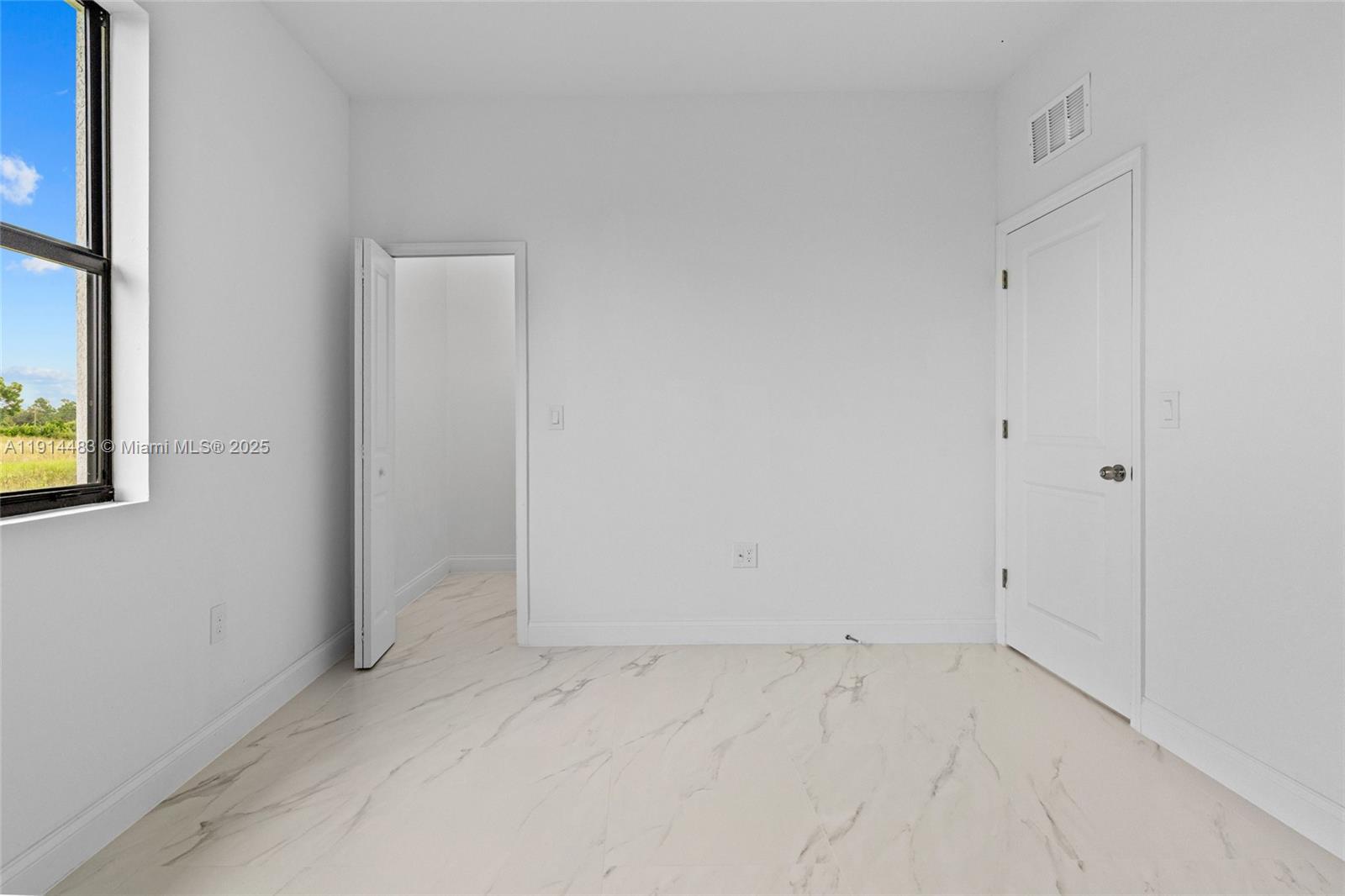 Open-concept living area at 933 GLEASON ST - Home in Lehigh Acres