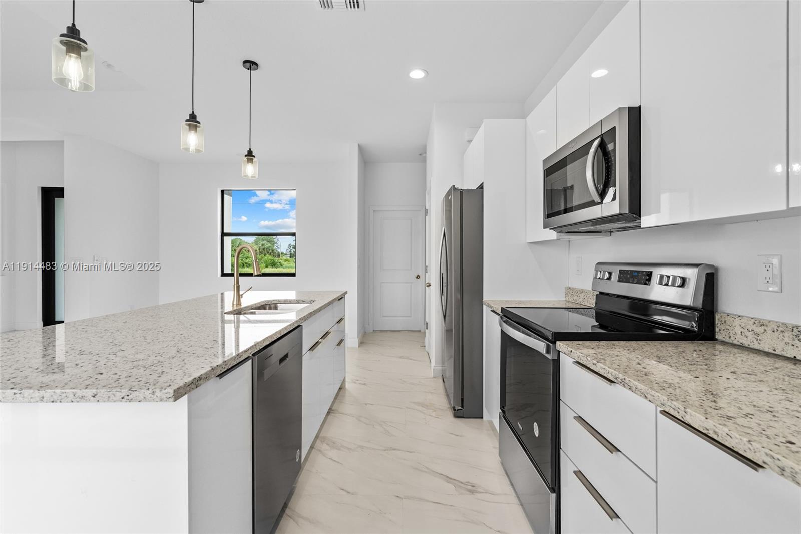 Well-appointed guest bedroom at 933 GLEASON ST - Home in Lehigh Acres