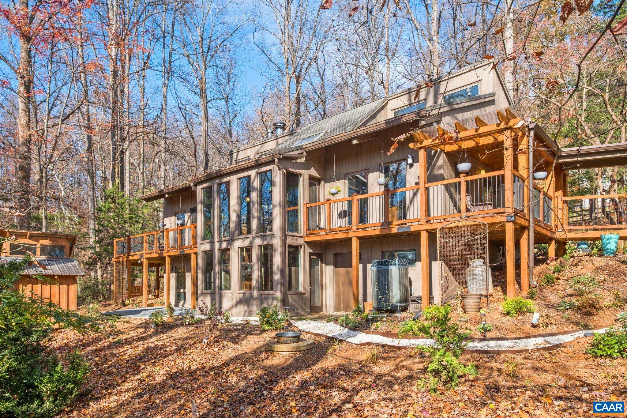 Discover the perfect blend of craftsmanship and comfort in this stunning post-and-beam home set on 2.4 private, wooded acres with beautiful mountain views. Flooded with natural light and rich with character, this 4-bedroom, 3.5-bath home has been thoughtfully updated throughout for modern living. Step inside to find all-new hardwood floors and a spacious, open layout framed by warm timber beams. The newly renovated kitchen features contemporary finishes, quality cabinetry, and ample workspace—ideal for everyday cooking or entertaining. All bathrooms have also been tastefully updated, offering fresh, modern style and comfort. The home’s generous bedroom layout includes a serene primary suite, while expansive windows throughout showcase the surrounding trees and distant peaks. Outside, enjoy the peace of a quiet, sought-after neighborhood, where privacy and nature meet convenience. If you’re looking for timeless architecture, modern upgrades, and a picturesque setting, this post-and-beam gem is not to be missed.