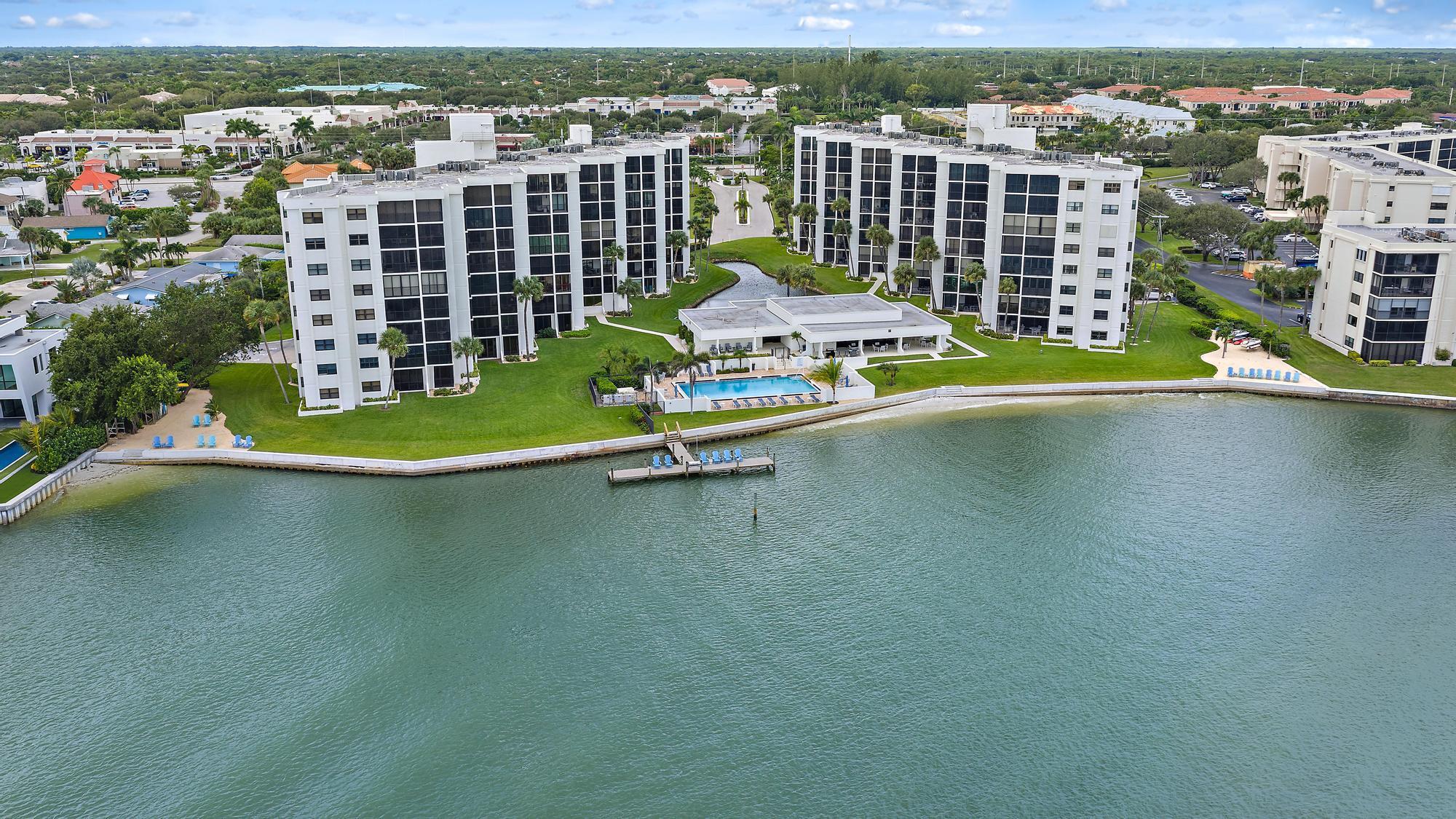 Step into this newly renovated 3-bedroom, 3-bathroom condominium with INTRACOASTAL VIEWS. Recent updates include two updated bathrooms, NEW A/C, LED lights, fresh paint and new outlets and switches. Located in a beautifully maintained community of Sandpointe Bay, residents enjoy access to a pool and clubhouse boasting spectacular intracoastal water views and a day dock for easy waterfront enjoyment. The clubhouse is an impressive centerpiece, featuring panoramic views of the pool and intracoastal, a full kitchen, indoor and outdoor dining areas, two outdoor grills and a spacious community room complete with his and hers bathrooms and sauna. There's also a large meeting room with multiple tables, ideal for gatherings or events, plus a well-equipped workout room for fitness enthusiasts.