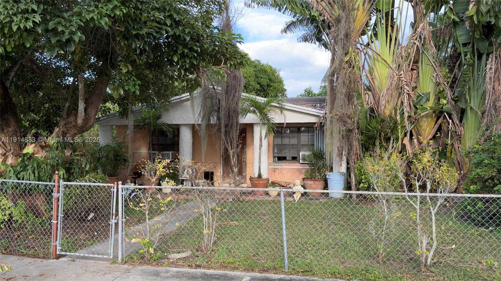 Spacious 4-bedroom, 2-bath single-family home in Richmond?Heights (unincorporated Miami-Dade). Built in 1973, this residence offers approximately 2,024?sq?ft of living space on a 0.17-acre lot. Floor plan features a large living area, separate dining space and generously sized bedrooms. The primary suite includes an en-suite bathroom, with three additional bedrooms down the hall. The kitchen and baths are in original condition—ideal for a modern renovation. Tile flooring throughout. Outdoors, a fenced backyard provides room to add a pool or patio. Located minutes from Zoo Miami, The?Falls shopping mall and major commuter routes, this property offers both convenience and strong future potential.