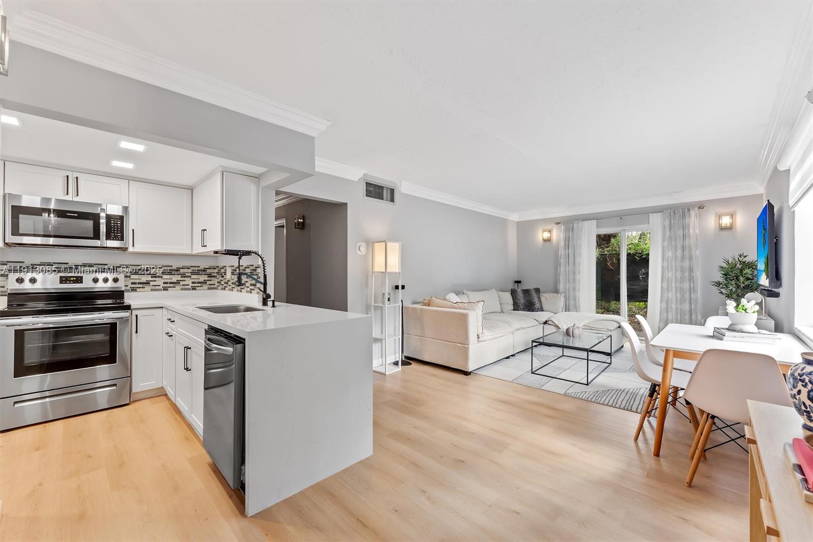 Nested in the heart of Pinecrest, this beautifully updated 2BR/1BA corner unit offers boutique-style living! This bright first-floor home features impact windows & sliding doors that fill the space with natural light. Inside, enjoy vinyl floors throughout and a modern kitchen with quartz countertops & recently updated appliances. The large master bedroom includes a walk-in closet, and the bathroom is fully renovated with sleek finishes. In-unit washer/dryer adds convenience. Relax at the community pool or enjoy your private outdoor area. Gated community with 2 assigned parking spaces, plus convenient access to guest parking. Prime location—just a walk to the Metrorail with direct transportation to Downtown Miami & minutes from Dadeland Mall, shops, & dining! CAN FINANCE, HOA HAS RESERVES.