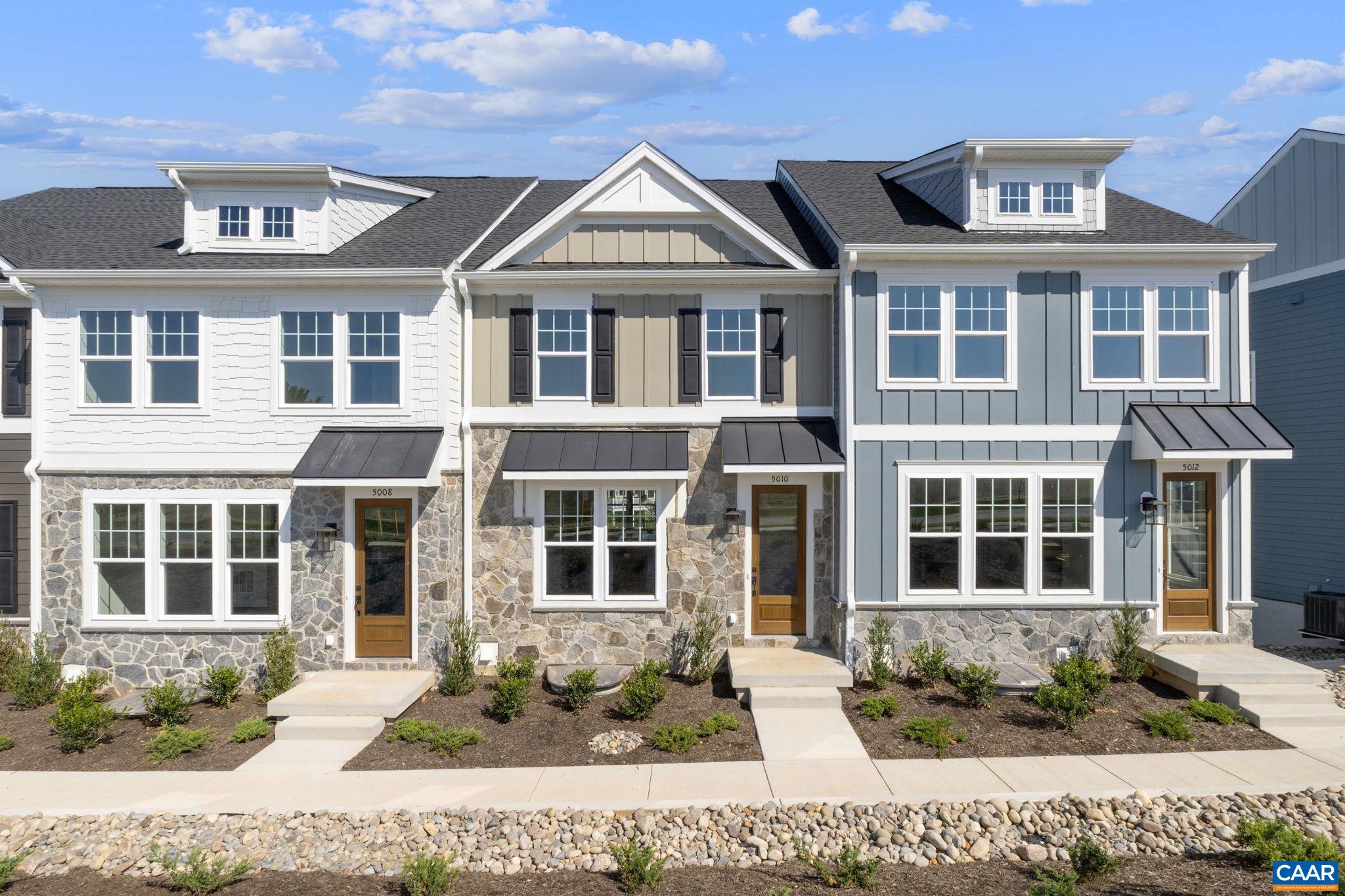 Just completed, this Dogwood townhome at Dunlora Park offers a fresh opportunity to move into one of Charlottesville’s most convenient communities. From the street-level entry, step into a wide open main floor with a welcoming family room, spacious kitchen, and dining area. A walk-in pantry, half bath, and maintenance-free deck make daily living and entertaining easy. The attached 2-car garage connects to a finished basement rec room, offering extra living or hobby space. Upstairs, you'll find a generous primary suite with ensuite bath, two additional bedrooms, a full hall bath, and a laundry area for added convenience. Actual photos are coming soon. Just minutes from Downtown Charlottesville, this is a location that keeps you close to the best of the city. A limited number of homes remain! Actual photos.