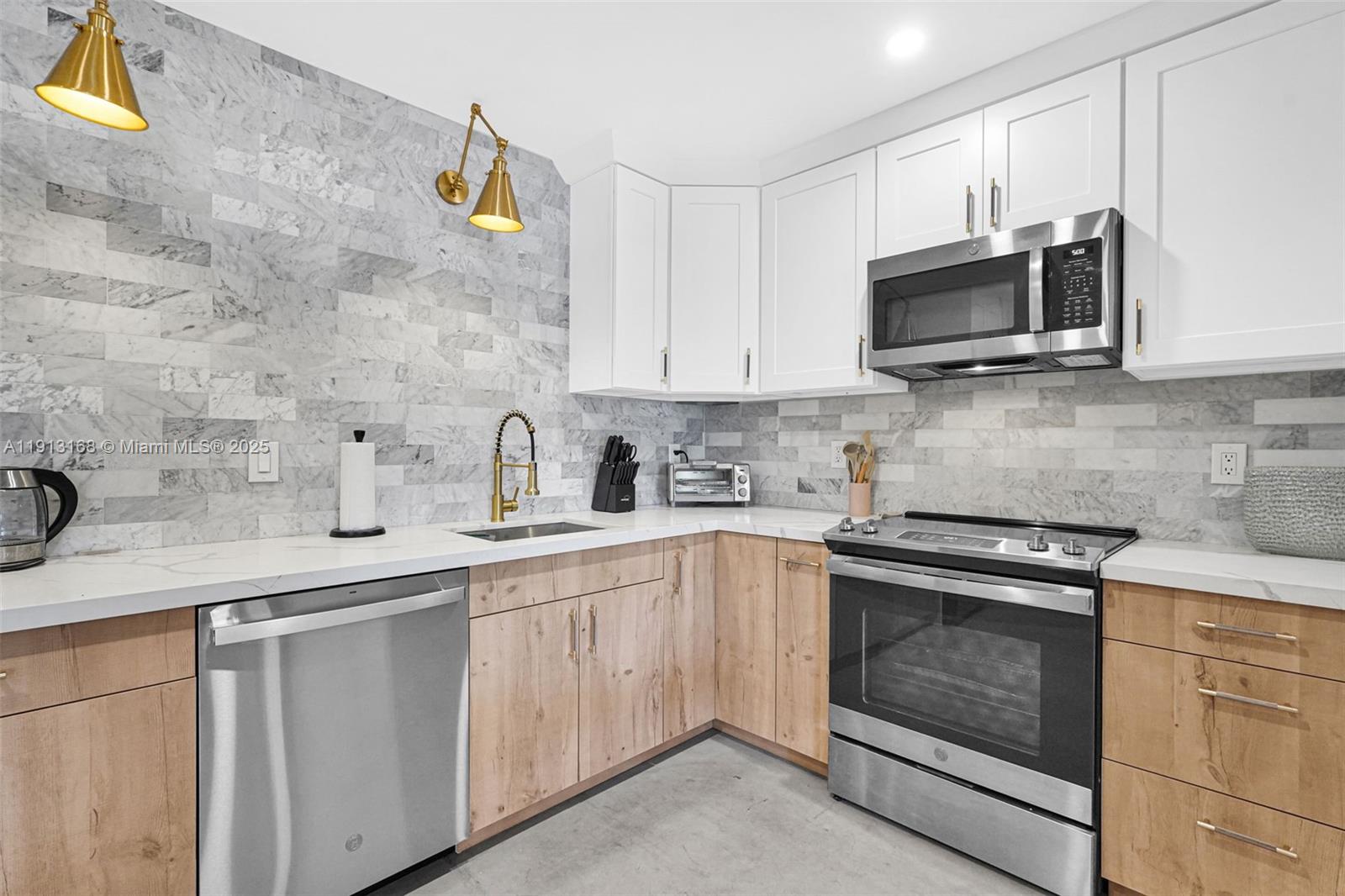 Bright, spacious, & tastefully renovated 3-BR, 2-bath home in the heart of Hallandale Beach. well-maintained property features open-floor plan with tons of natural light. Featuring Living room/dining area, 2 BR, 1 bath and kitchen. Also attached, a versatile in-law suite with a separate entrance, with its own Living Room, kitchen, 1 BR and 1 Bath. Great for guests, extra income / Airbnb. The property can be easily converted to a 4 BR / 2 Bath house. both kitchens are renovated, stainless steel appliances, quartz countertops, and ample cabinet space. All bedrooms are well sized, both bathrooms are renovated with new plumbing. The roof is 5 yrs old. new L.E.D recessed lights, and new doors. Large fenced landscaped backyard with patio and a gazebo great for relaxing & entertaining. A MUST SEE